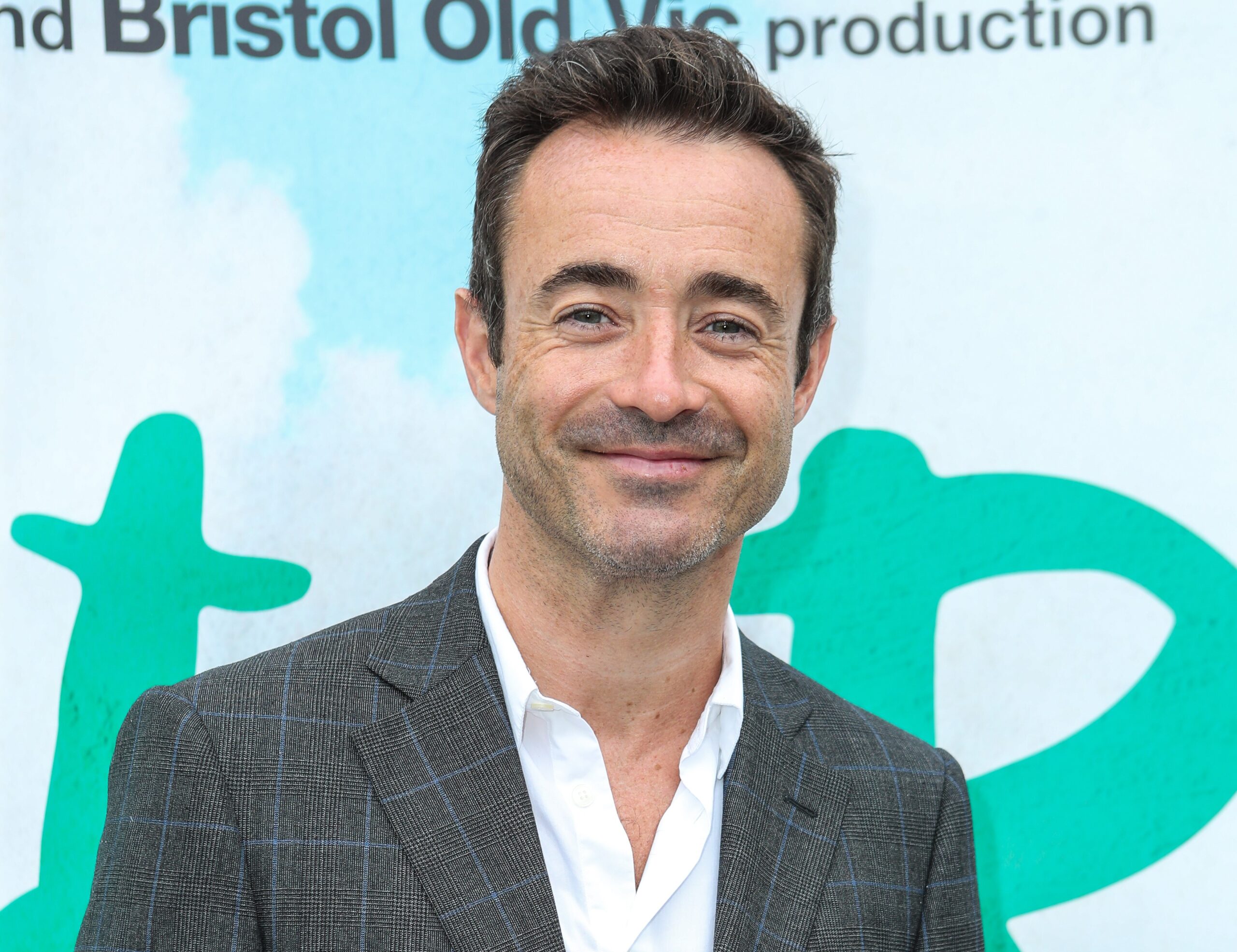 Joe McFadden smiling at event