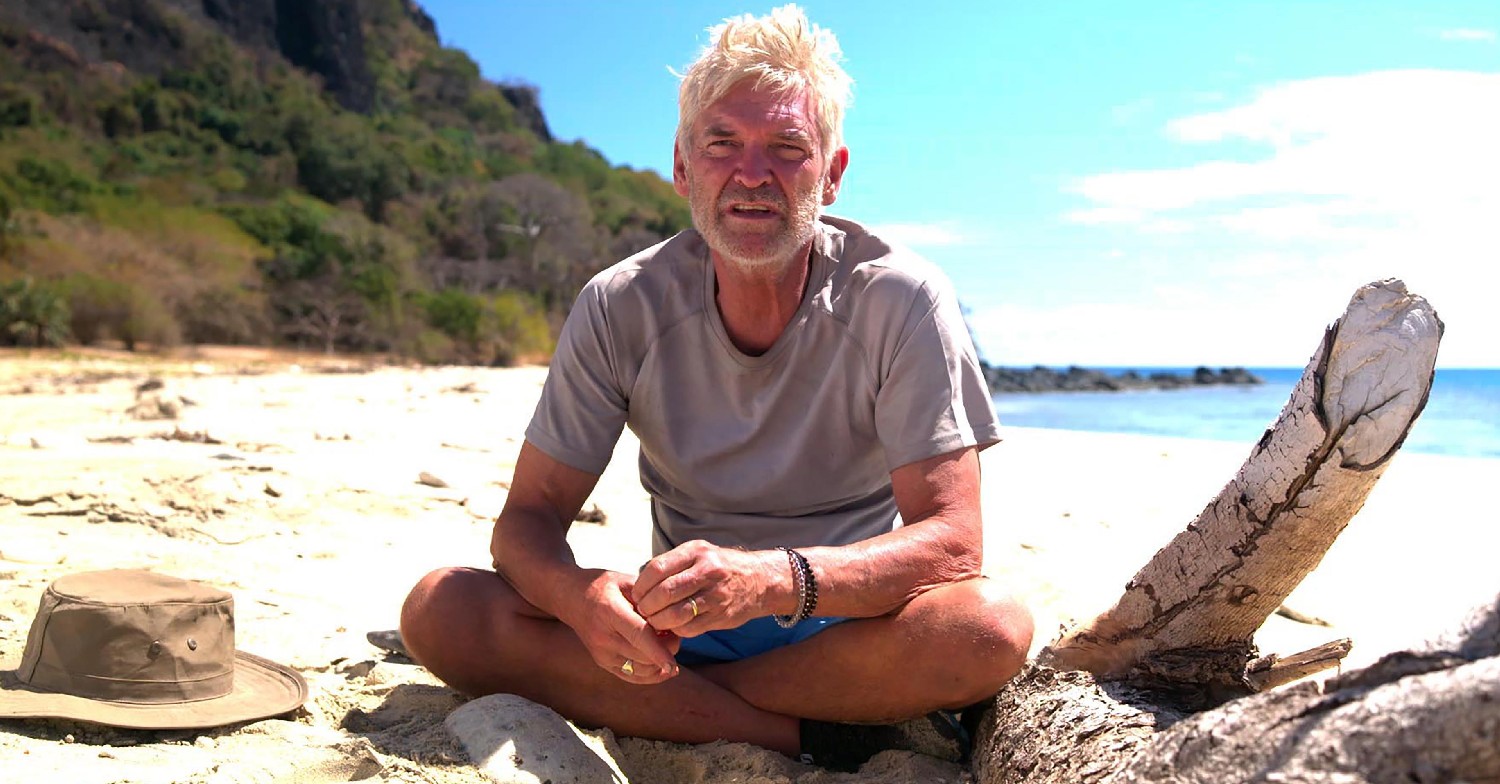 Phillip Schofield sat on a beach in Channel 5 show Cast Away