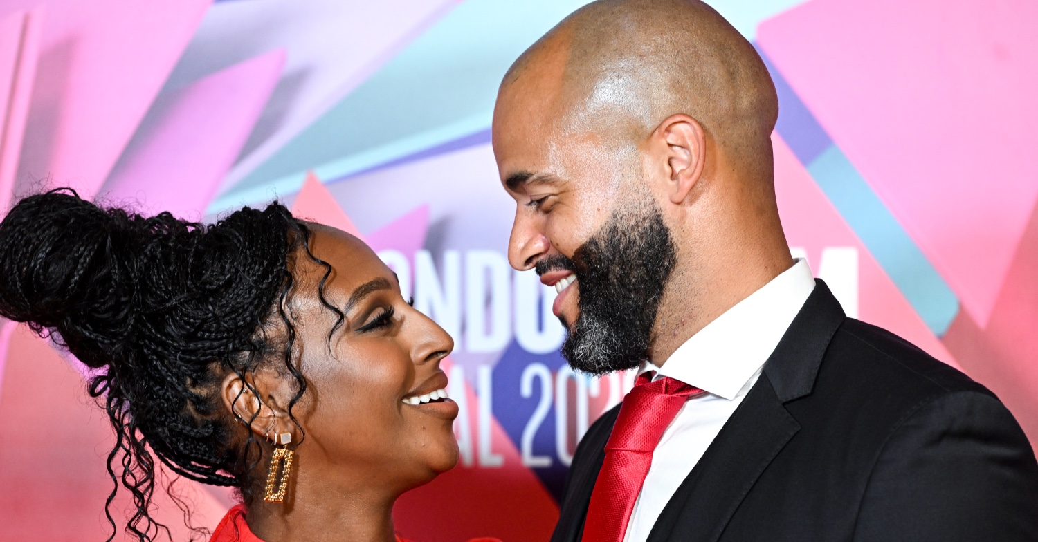 Alexandra Burke staring and smiling at her partner Darren