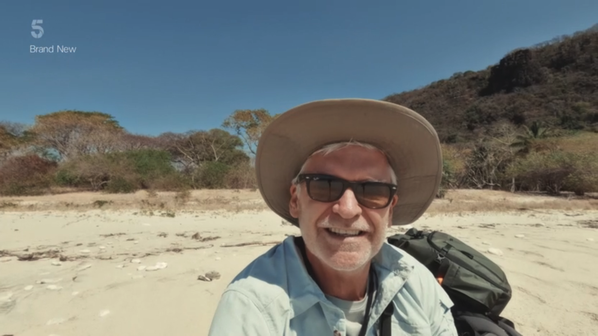 Phillip Schofield on a desert island in a sunhat