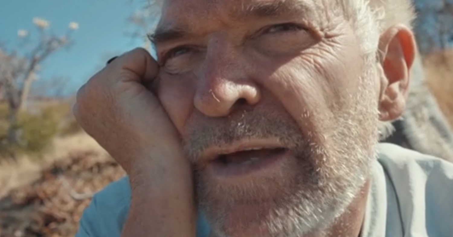 Phillip Schofield frowning and holding his face on Cast Away