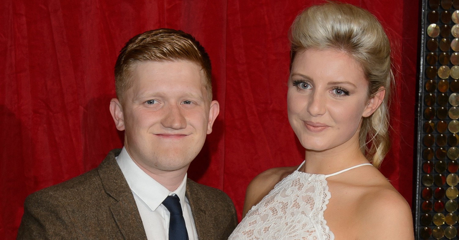 Sam Aston and wife Briony smiling