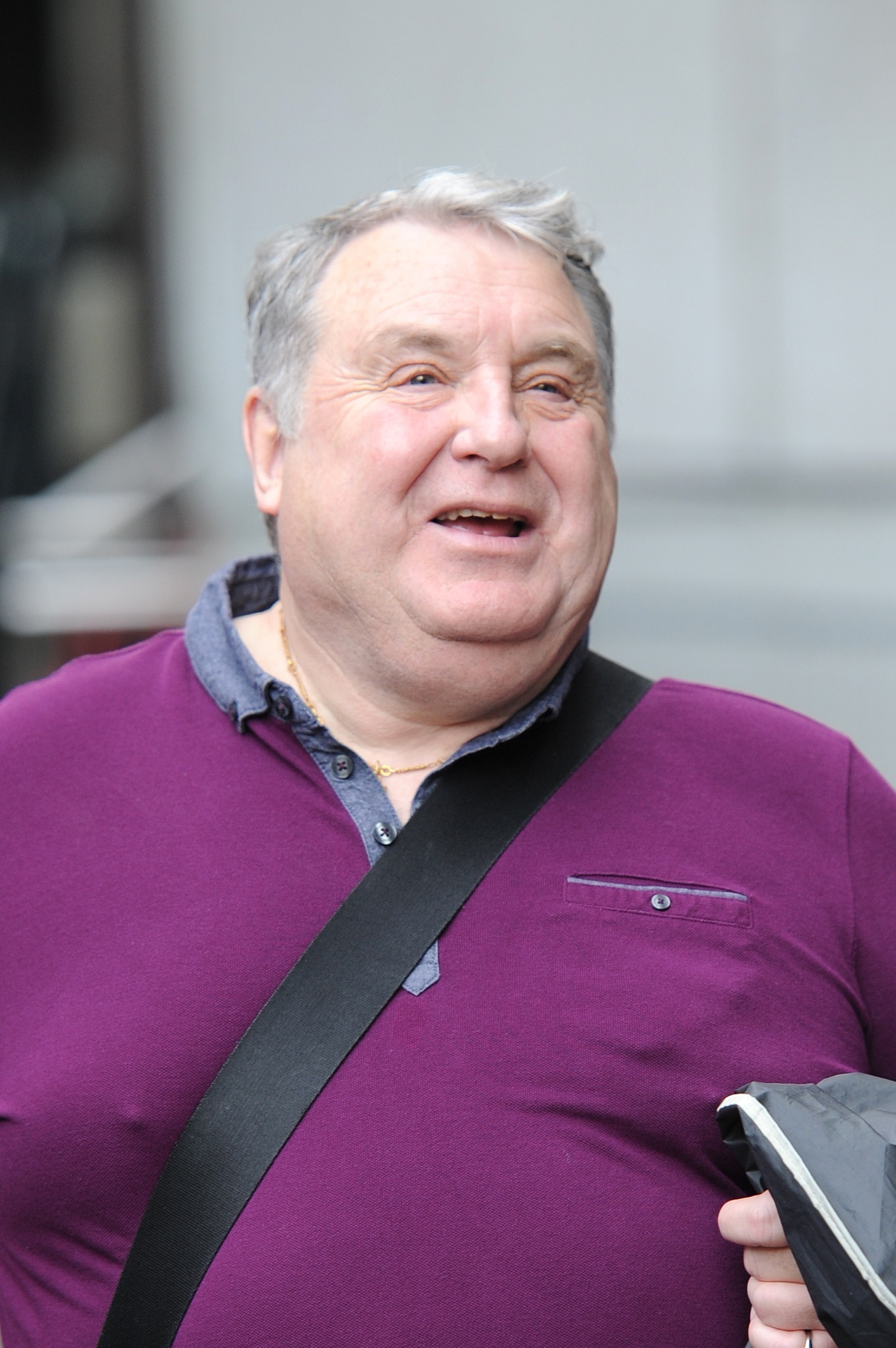 Russell Grant smiling in the street