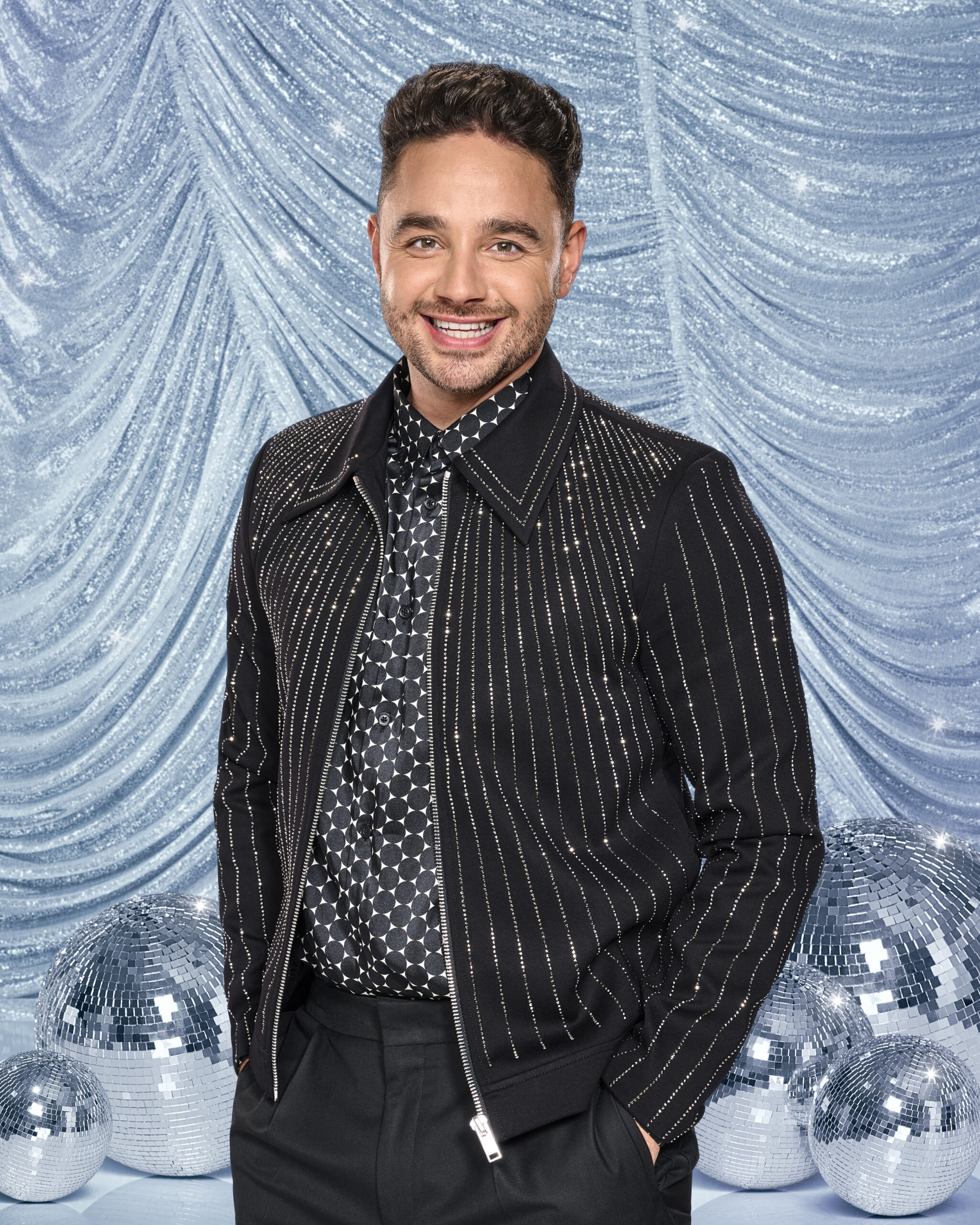 Adam Thomas smiling in Strictly Come Dancing pic