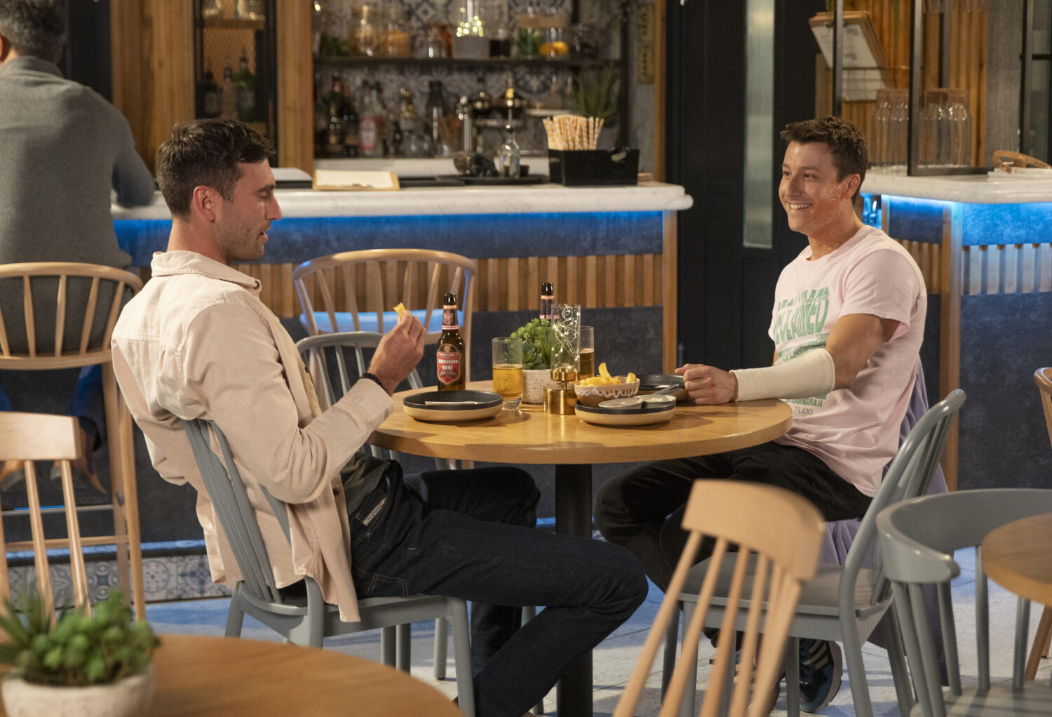 Ryan and Kit share a beer in Coronation street