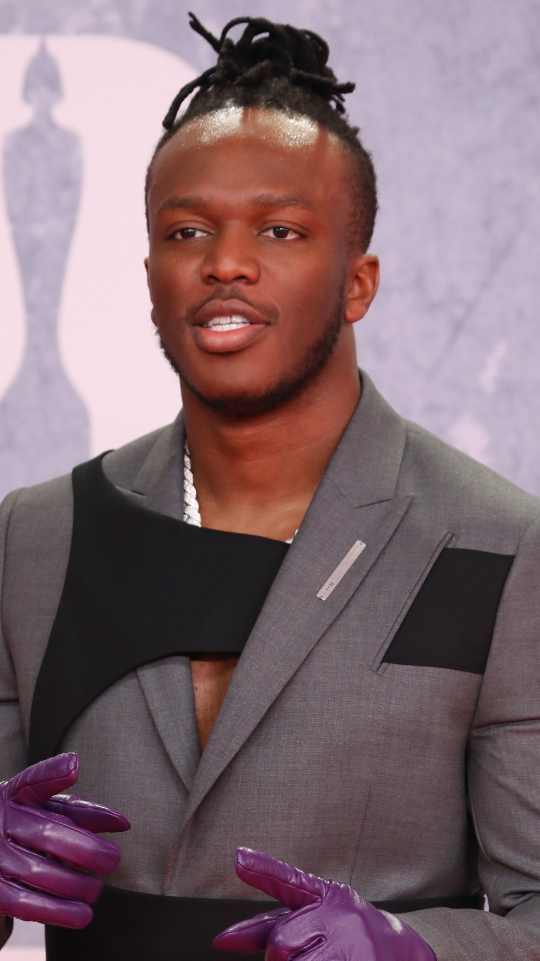 KSI posing on the red carpet at the Brits