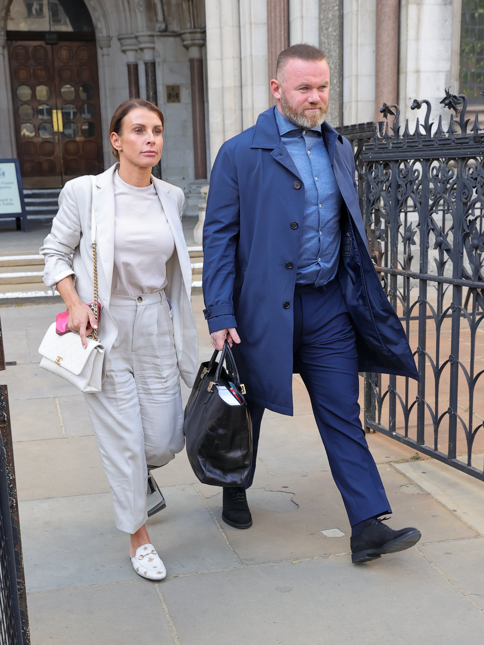 Coleen and Wayne Rooney leaving court