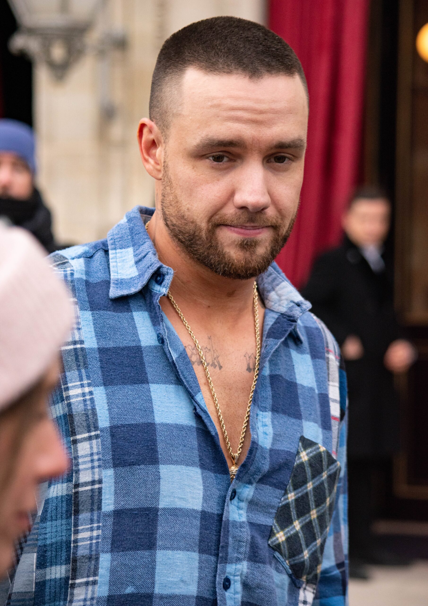 Liam Payne in blue checkered shirt during outing