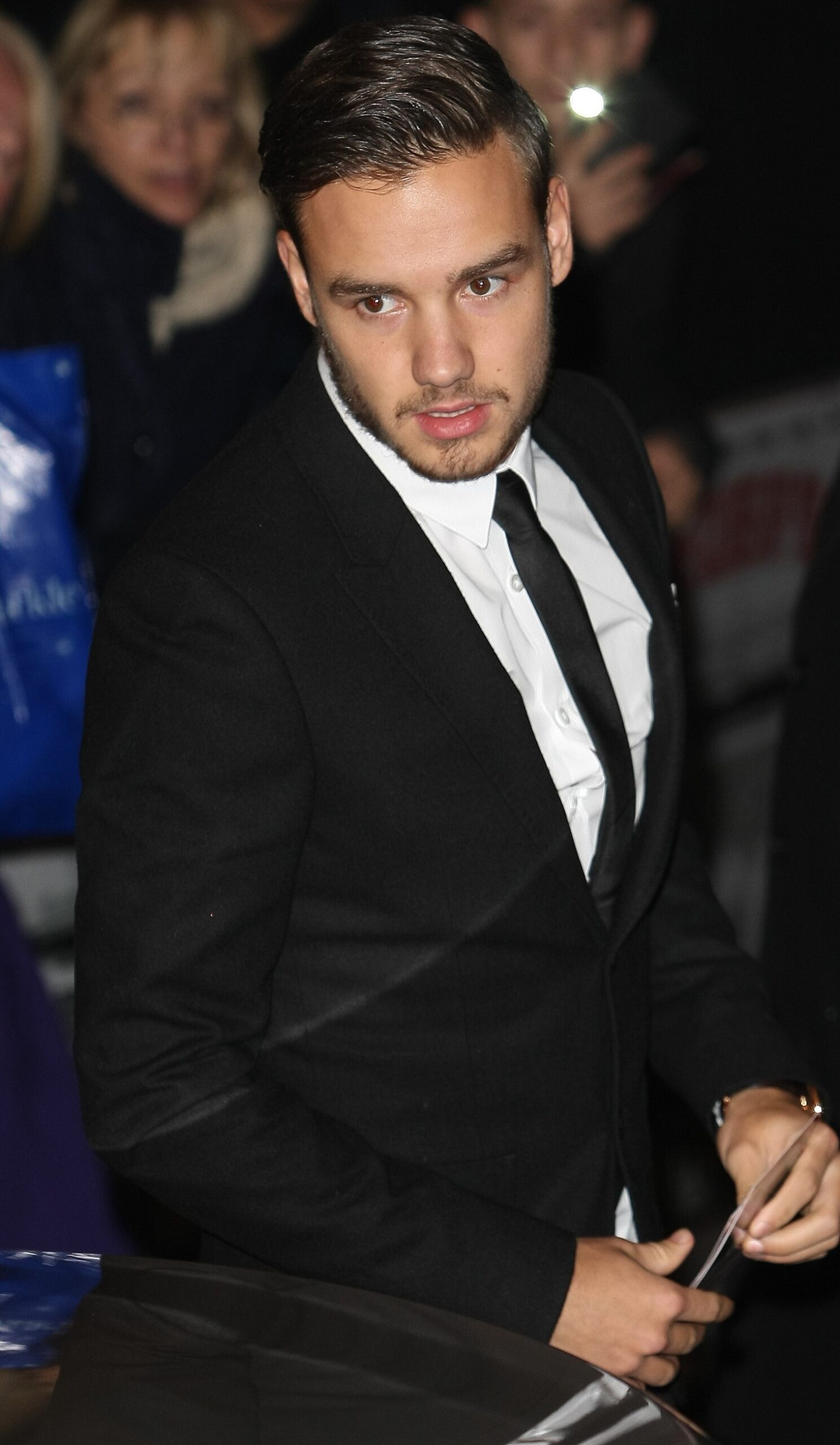 Liam Payne at showbiz event in black suit
