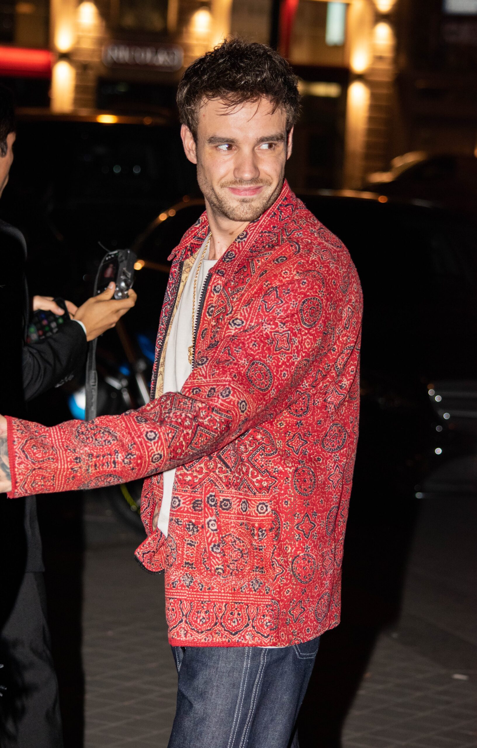 Liam Payne smiling on outing