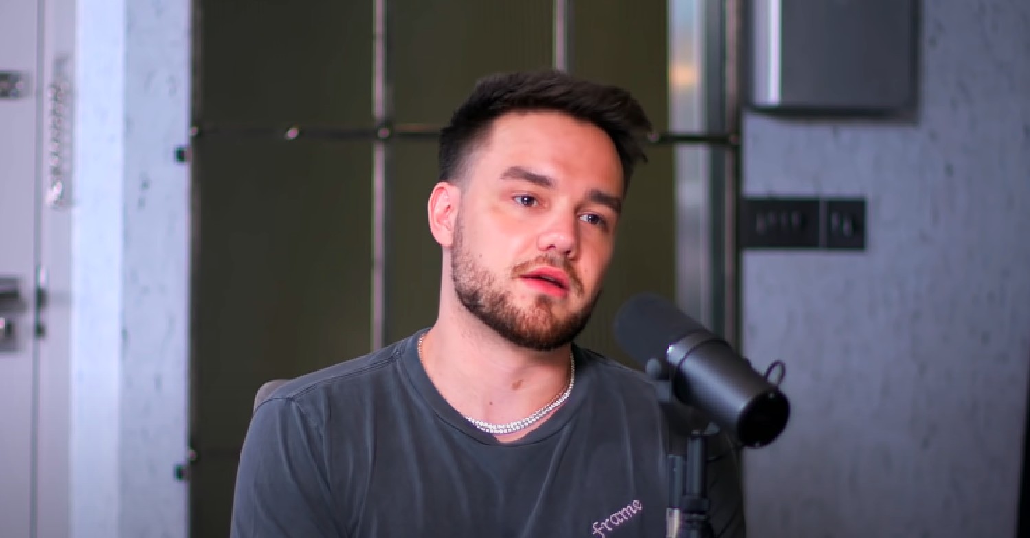 Liam Payne tilting his head while speaking on a podcast