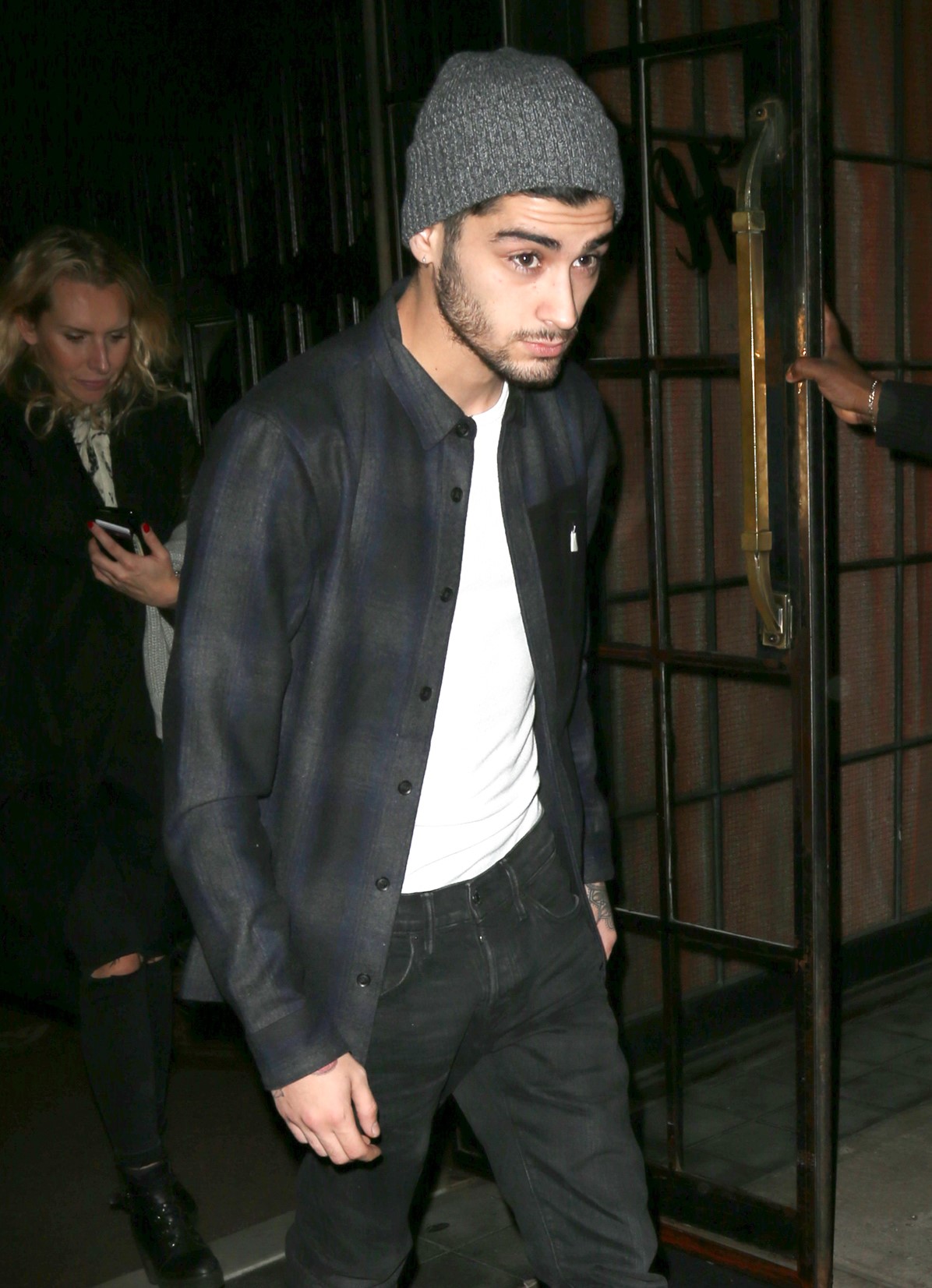Zayn Malik in checked shirt and hat on outing