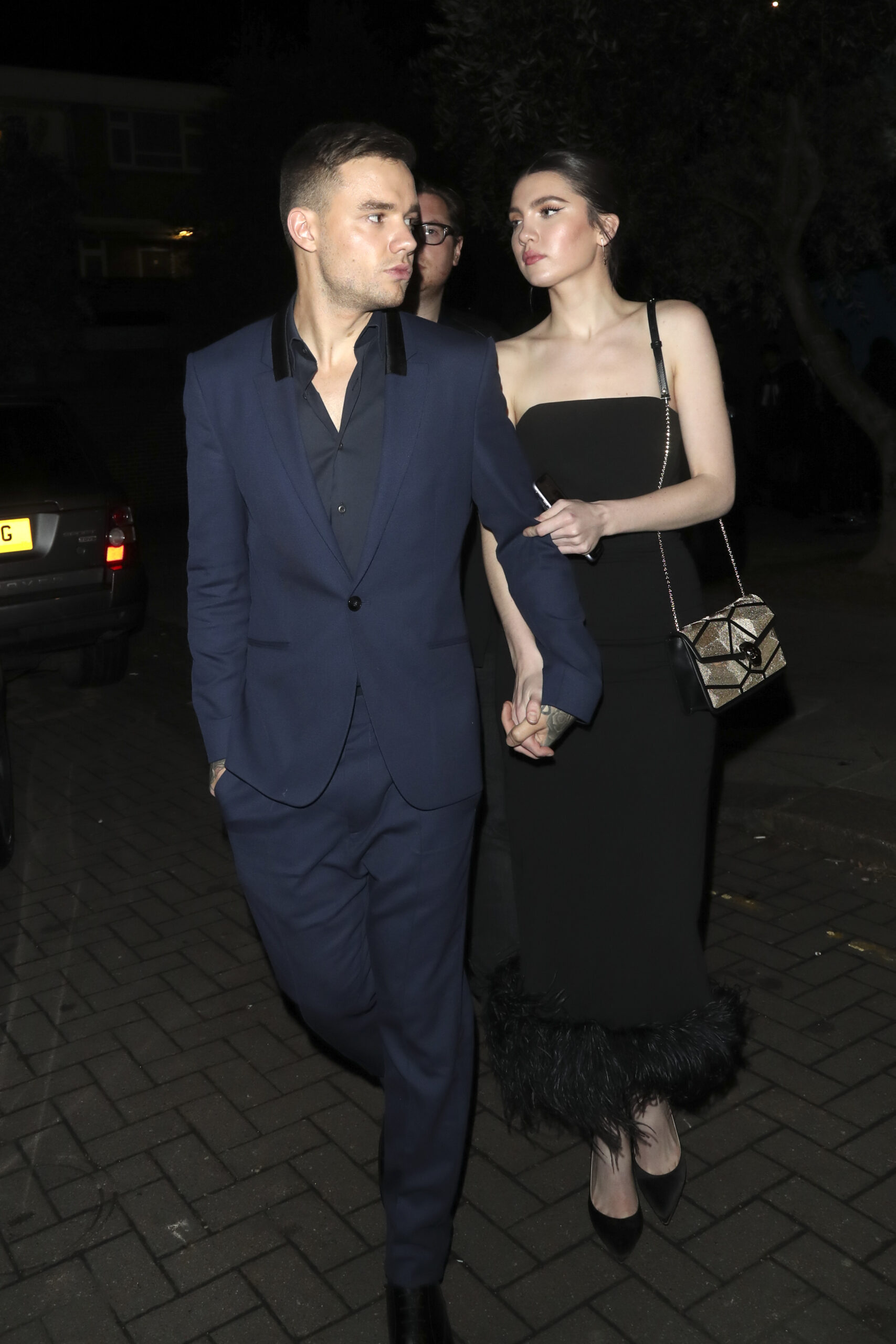 Liam Payne and Maya Henry holding hands