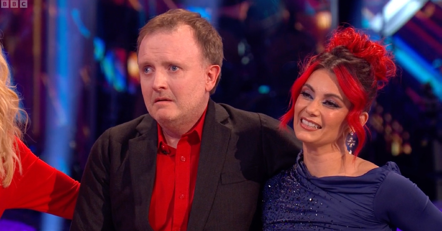 Chris McCausland and Dianne Buswell listening to judges on Strictly 