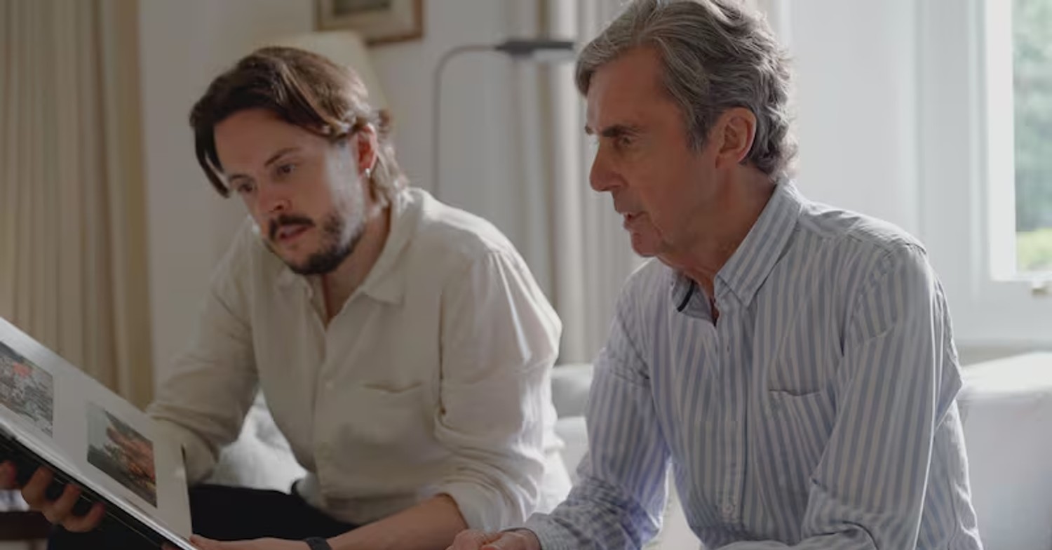 John Stapleton and Nick Stapleton reading a book