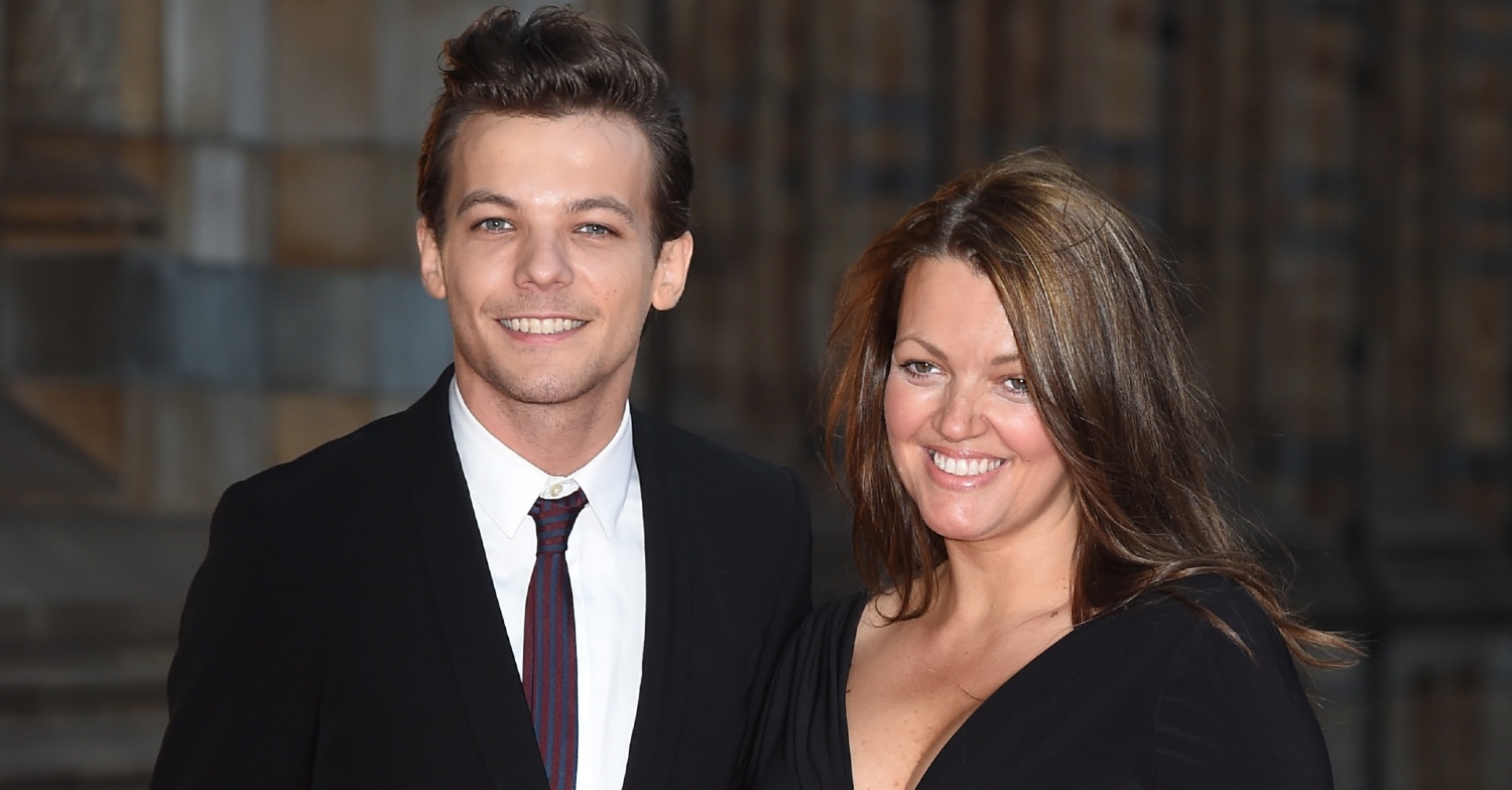 Louis Tomlinson and mum Johannah Deakin smiling together on the red carpet
