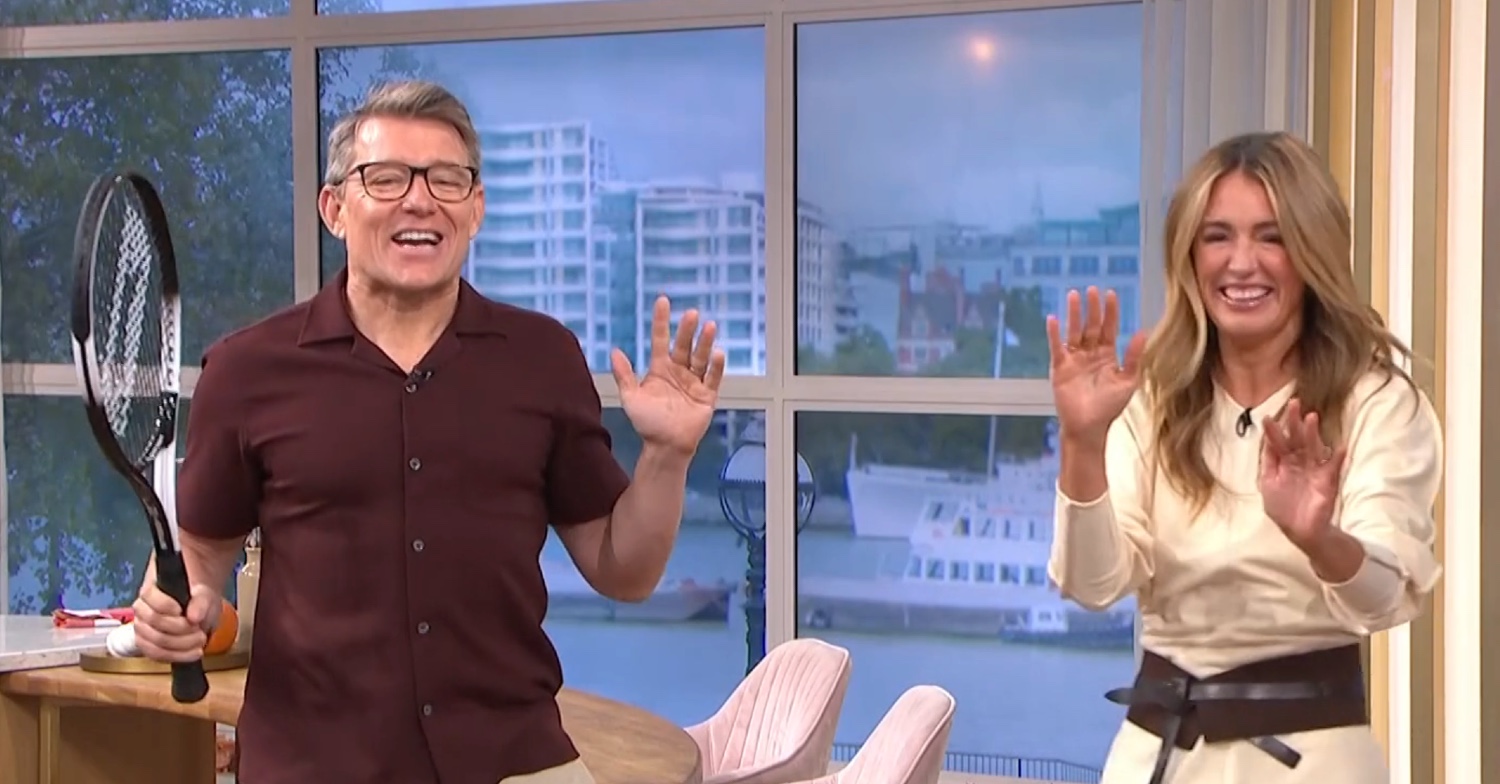 Ben Shephard holding a tennis racket in the This Morning studio beside a giggling Cat Deeley
