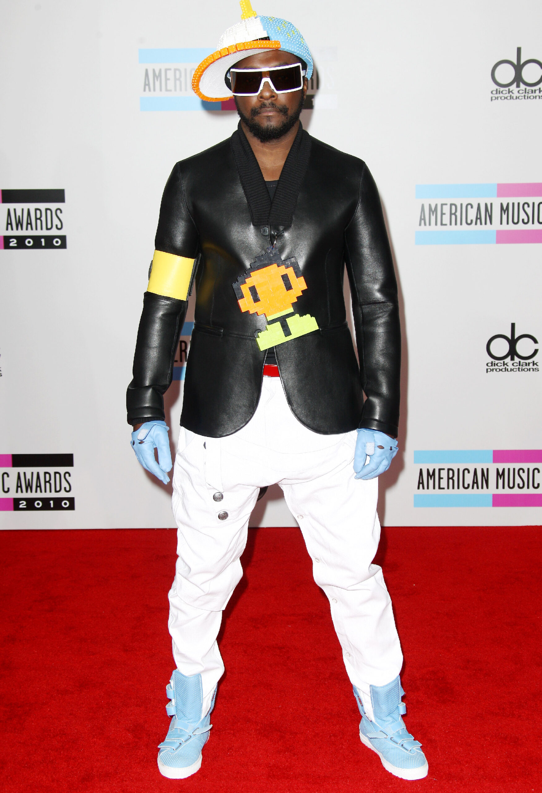 Will.i.am on a red carpet posing