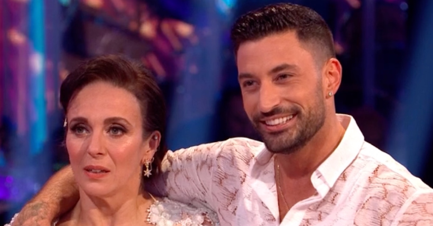 Giovanni Pernice smiling with his arm around Amanda Abbington on Strictly Come Dancing