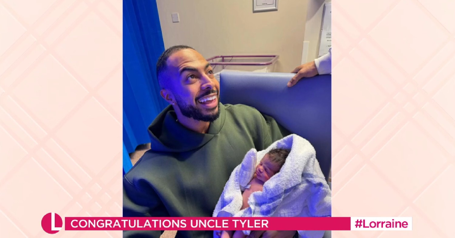 Tyler West holding nephew in photo shown on Lorraine