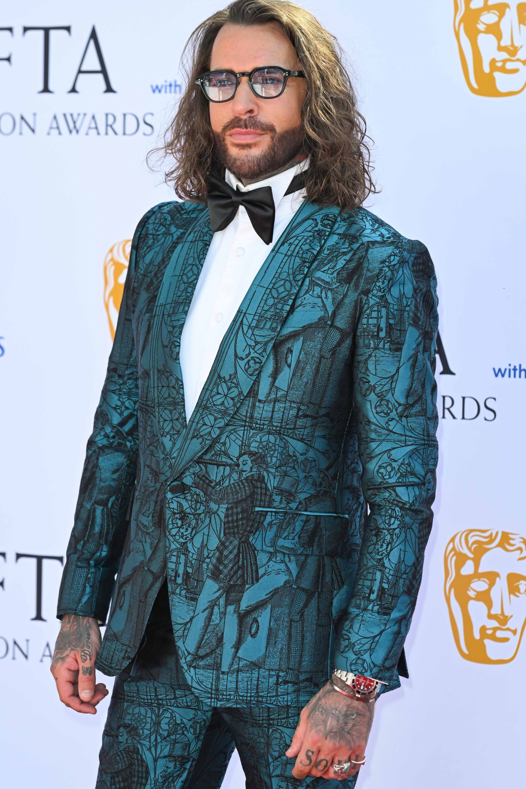 Pete Wicks posing at the BAFTAs