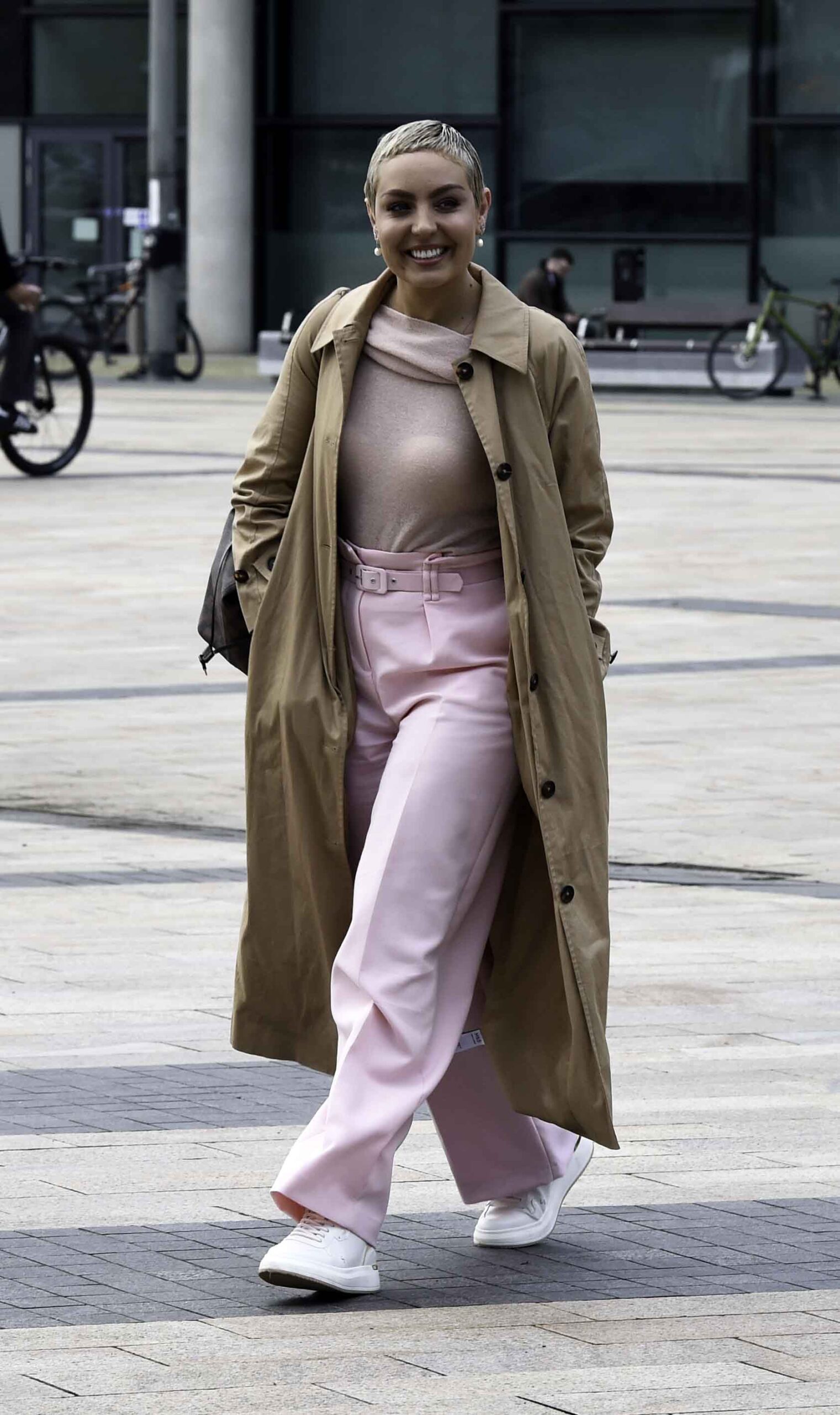 Amy Dowden from Strictly wearing pink trousers and smiling