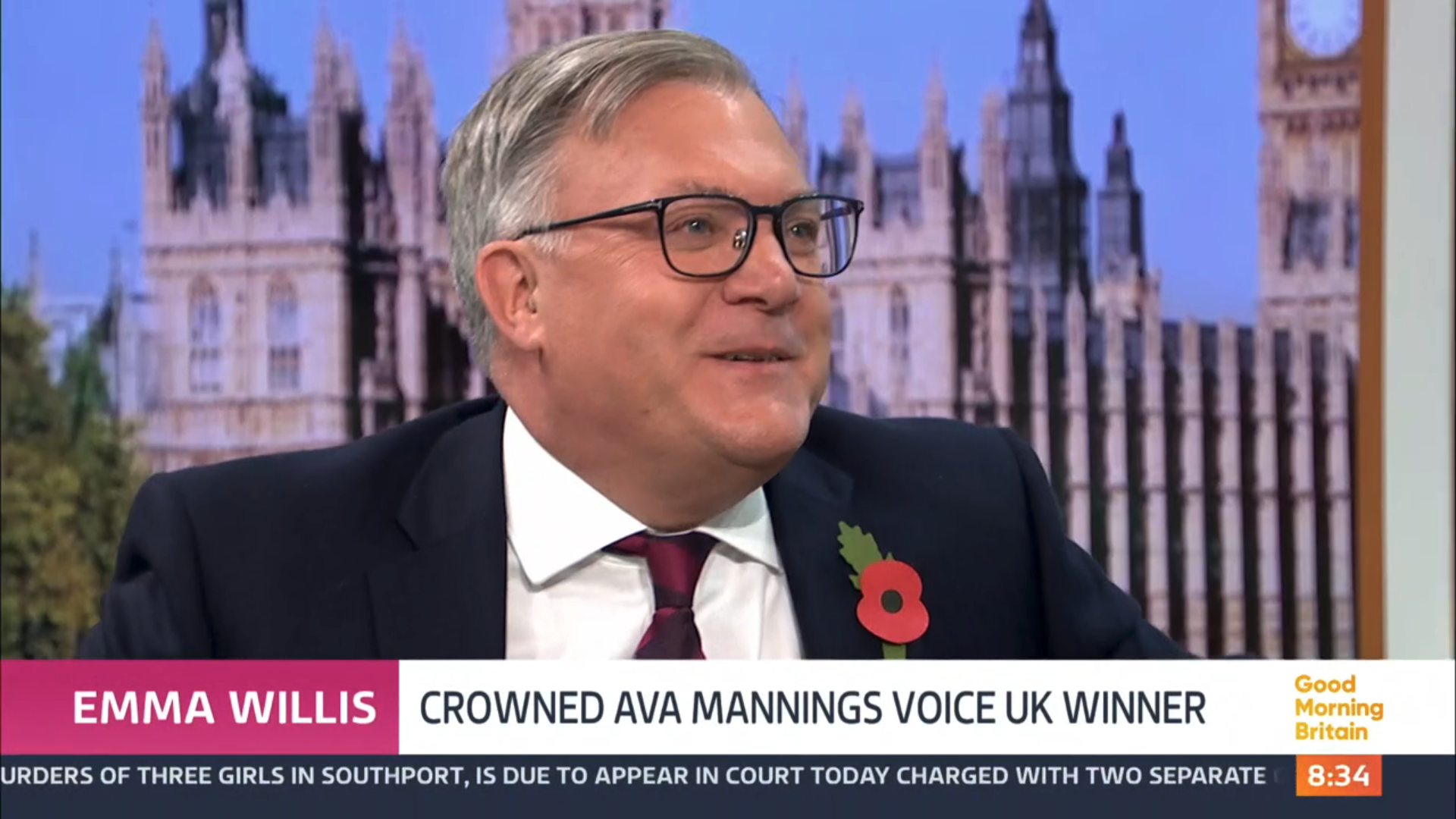 Ed Balls laughing on GMB in a suit