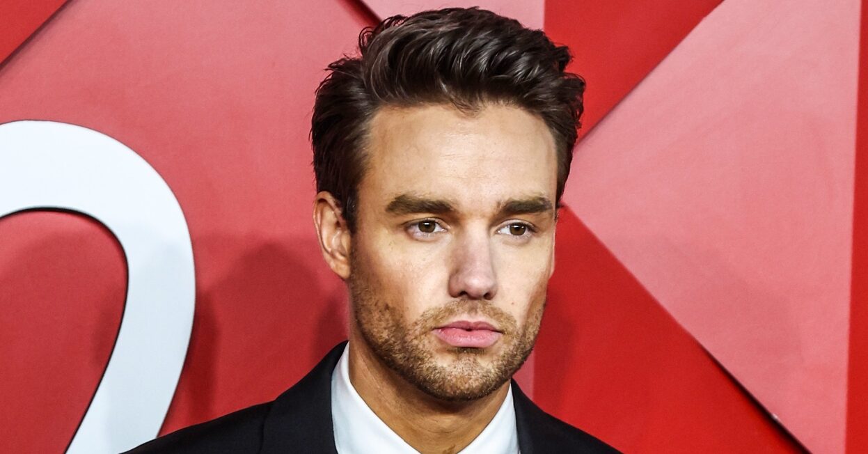 Liam Payne against a red background