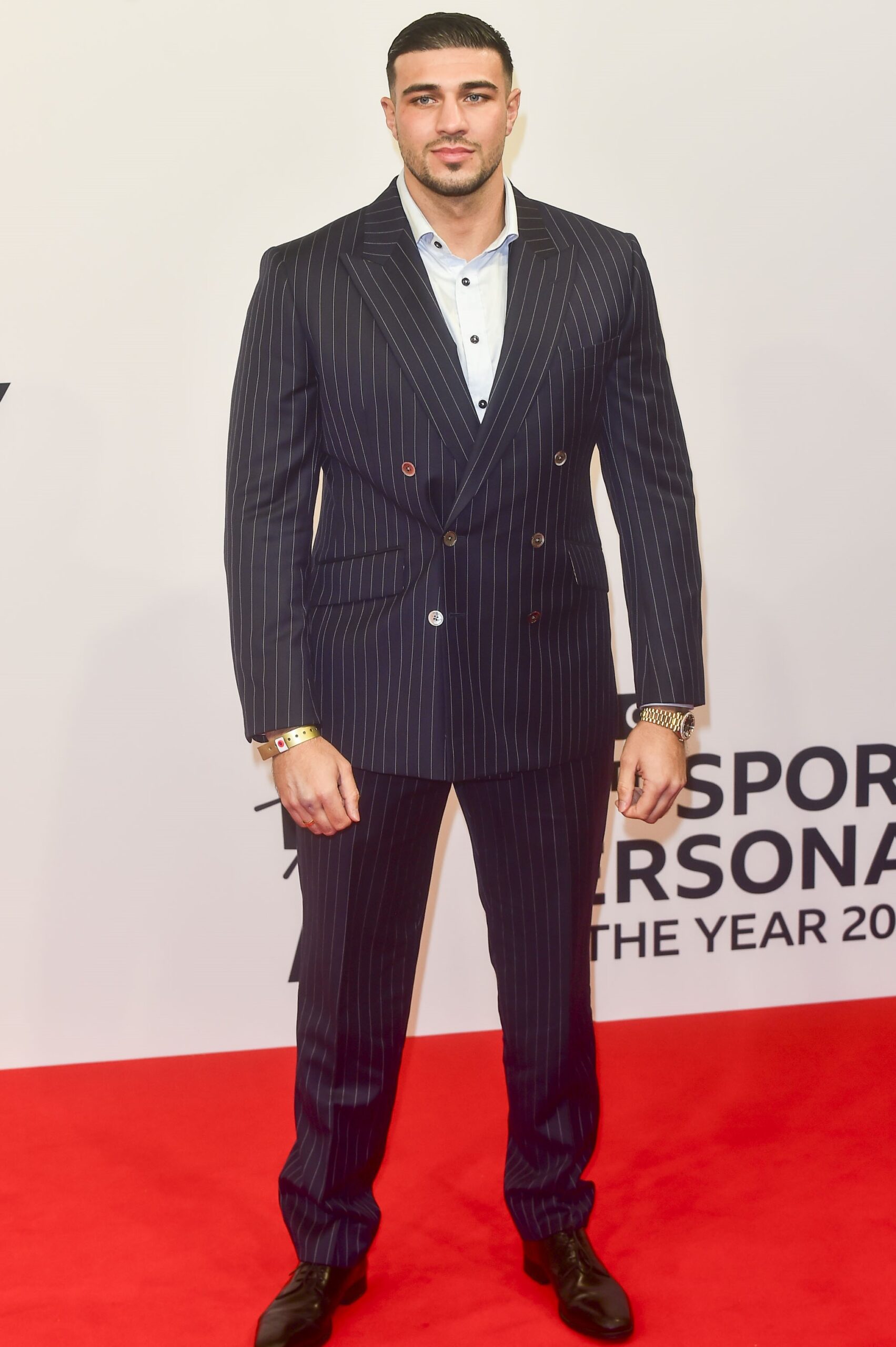 Tommy Fury posing at event