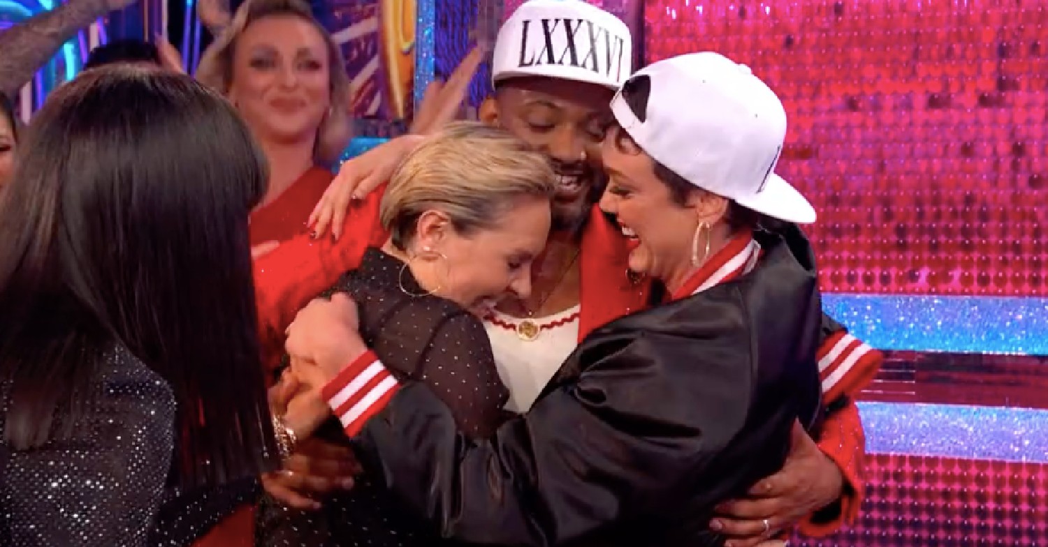 Amy, JB and Lauren hugging on Strictly 