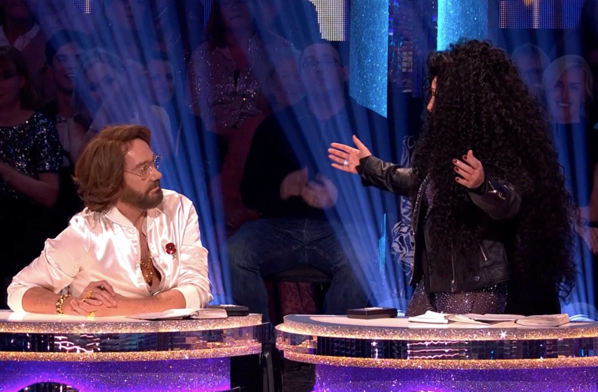 Craig Revel Horwood looking at Shirley Ballas as she stands on Strictly