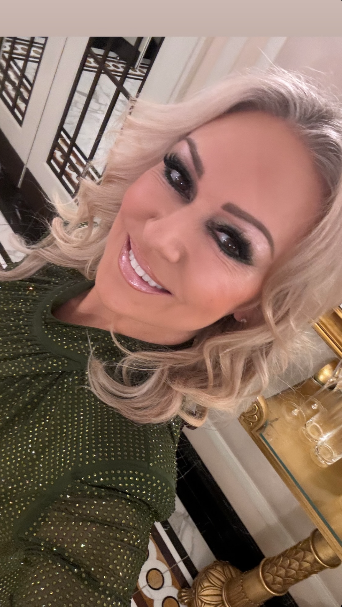 Kristina Rihanoff smiling in a green dress