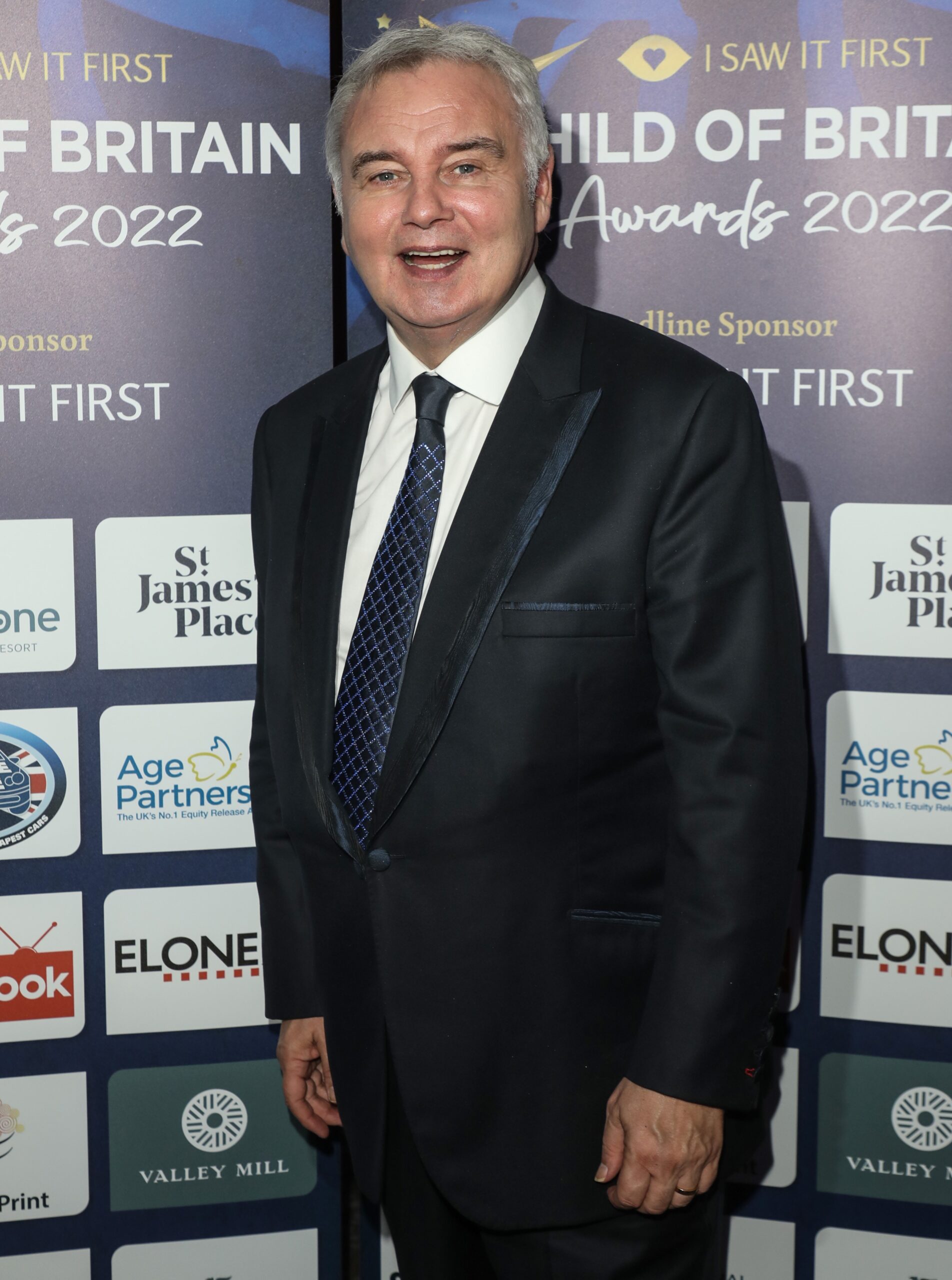 Eamonn Holmes smiling at event