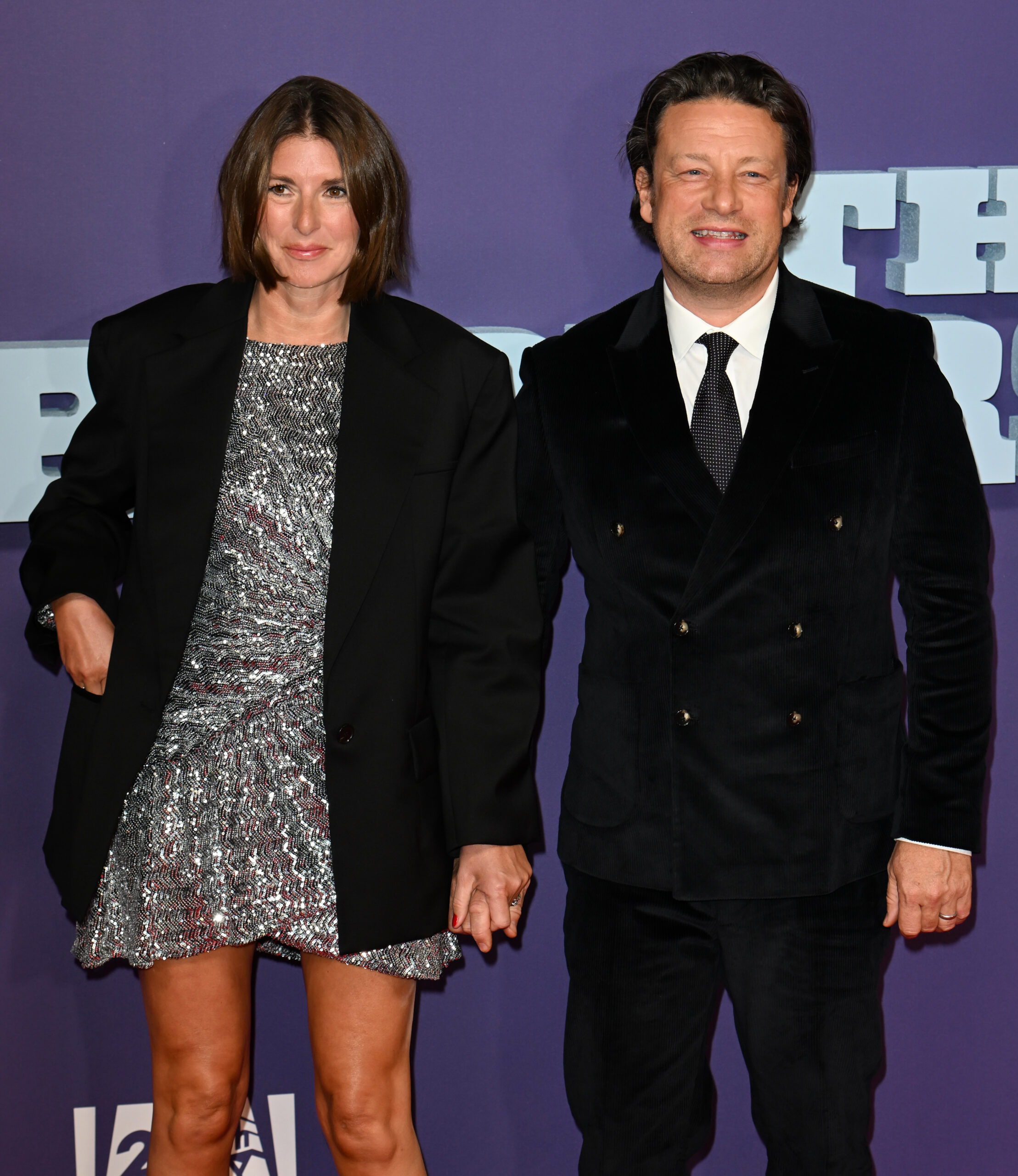 Jamie Oliver and wife Jools posing