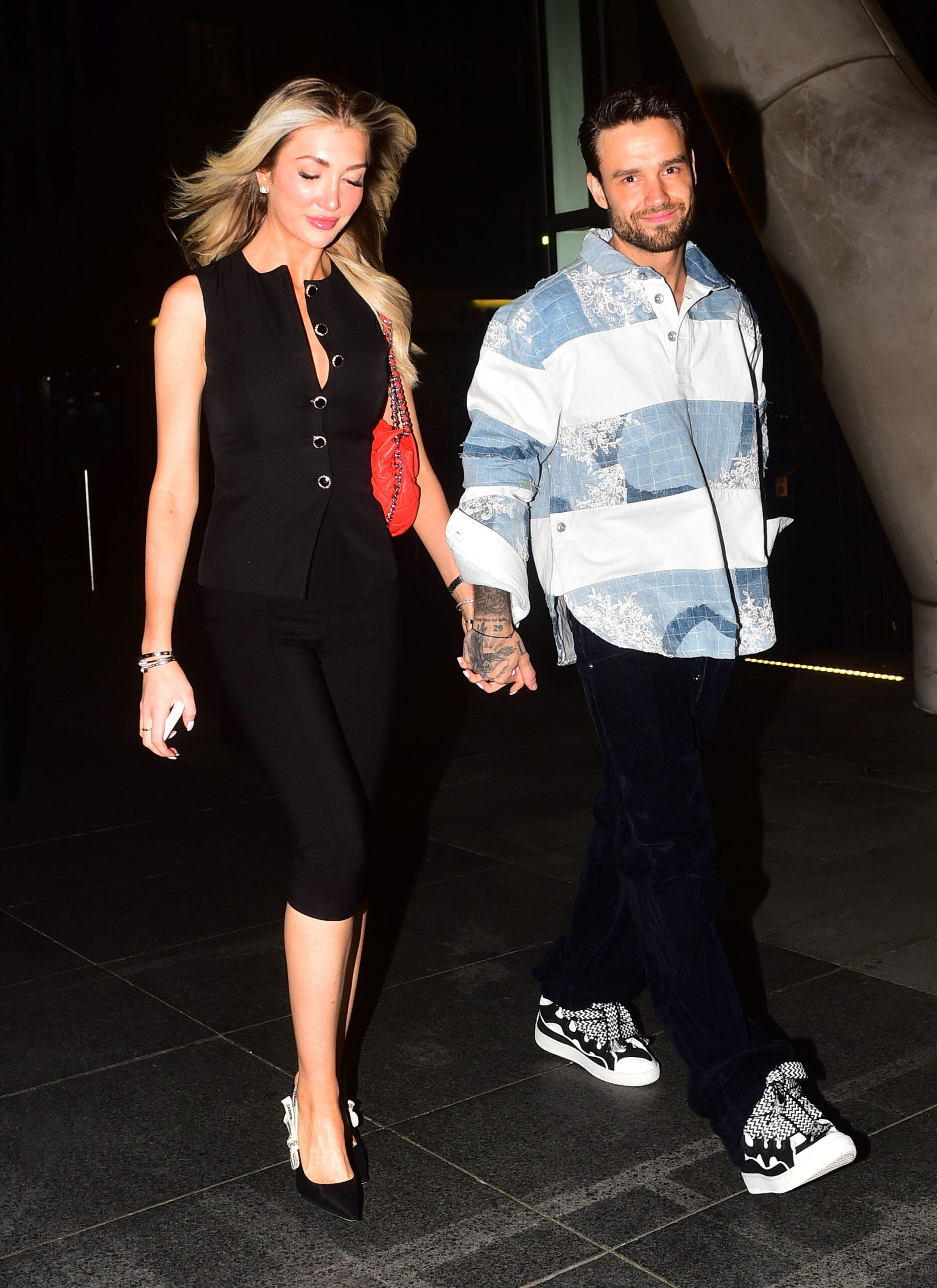 Liam Payne and Kate Cassidy holding hands
