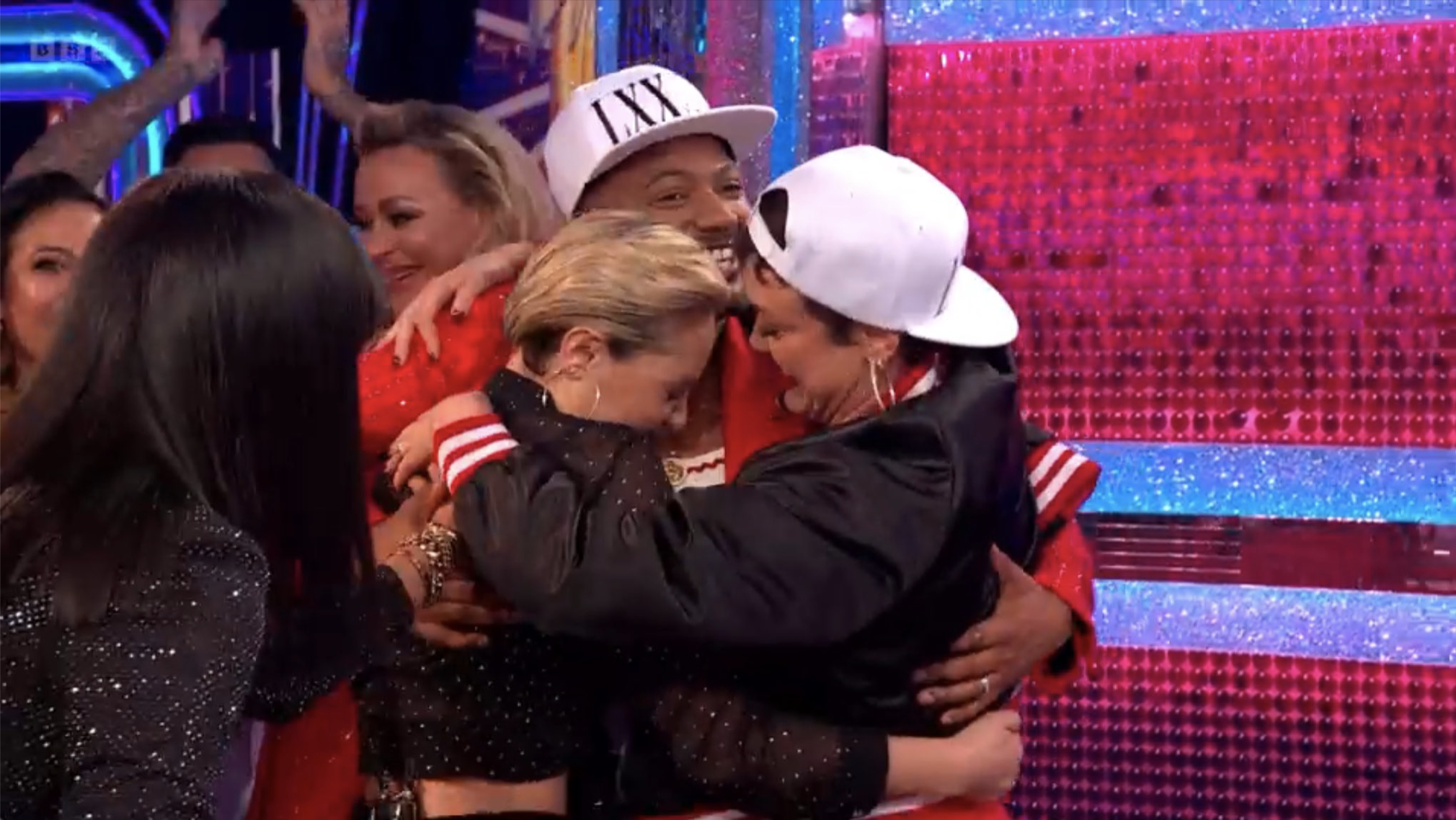 Amy Dowden, JB Gill and Lauren Oakley hugging on Strictly