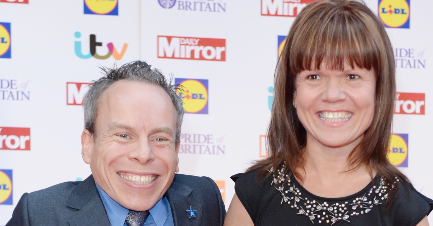 Warwick Davis smiling with his wife Samantha