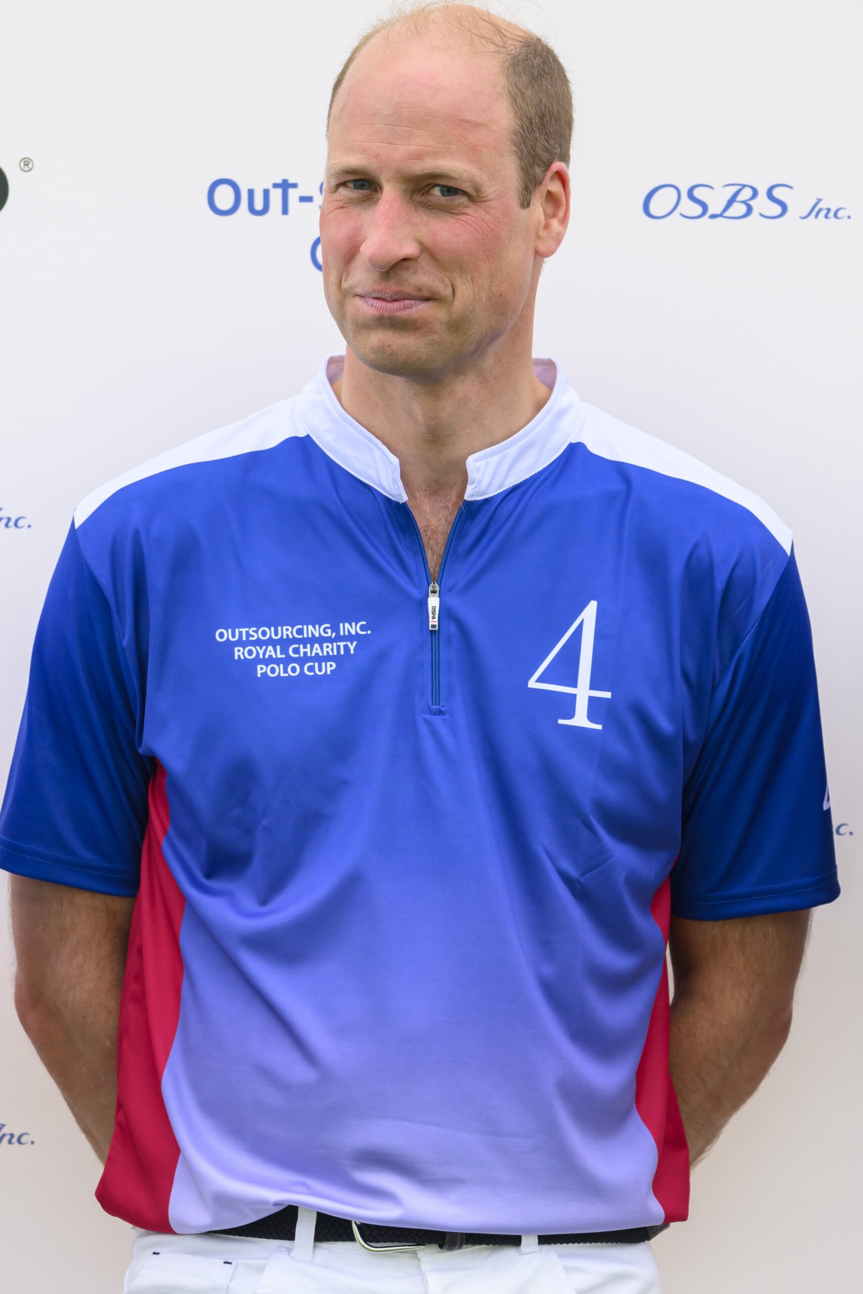 Prince William smiling at polo match