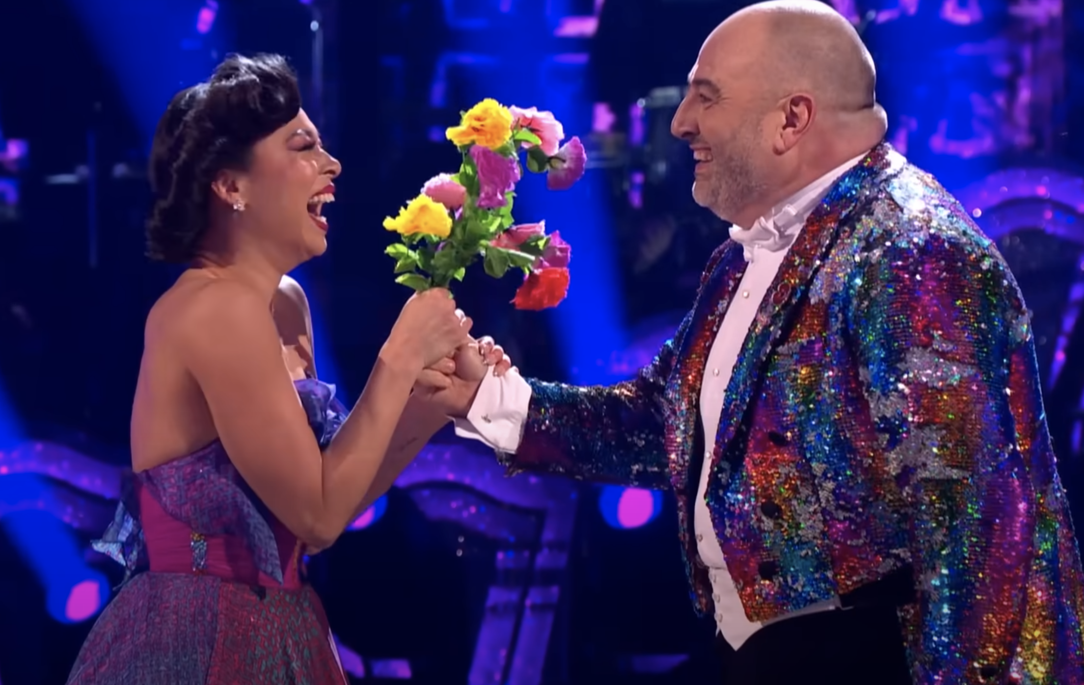 Strictly Come Dancing's Wynne Evans offers flowers to his dance partner Katya Jones
