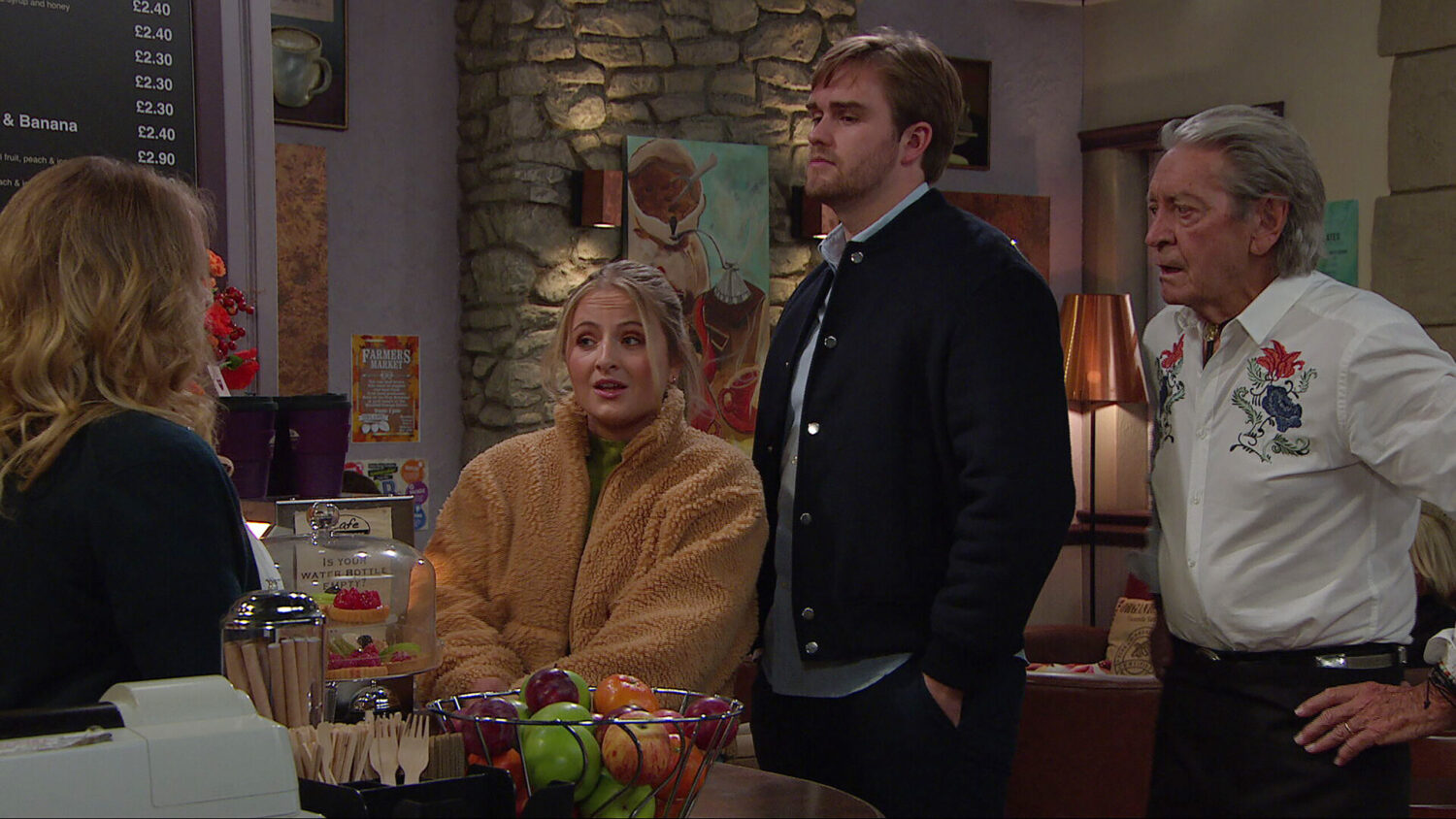 Tom, Nicola, Amelia and Rodney talking in the café on Emmerdale