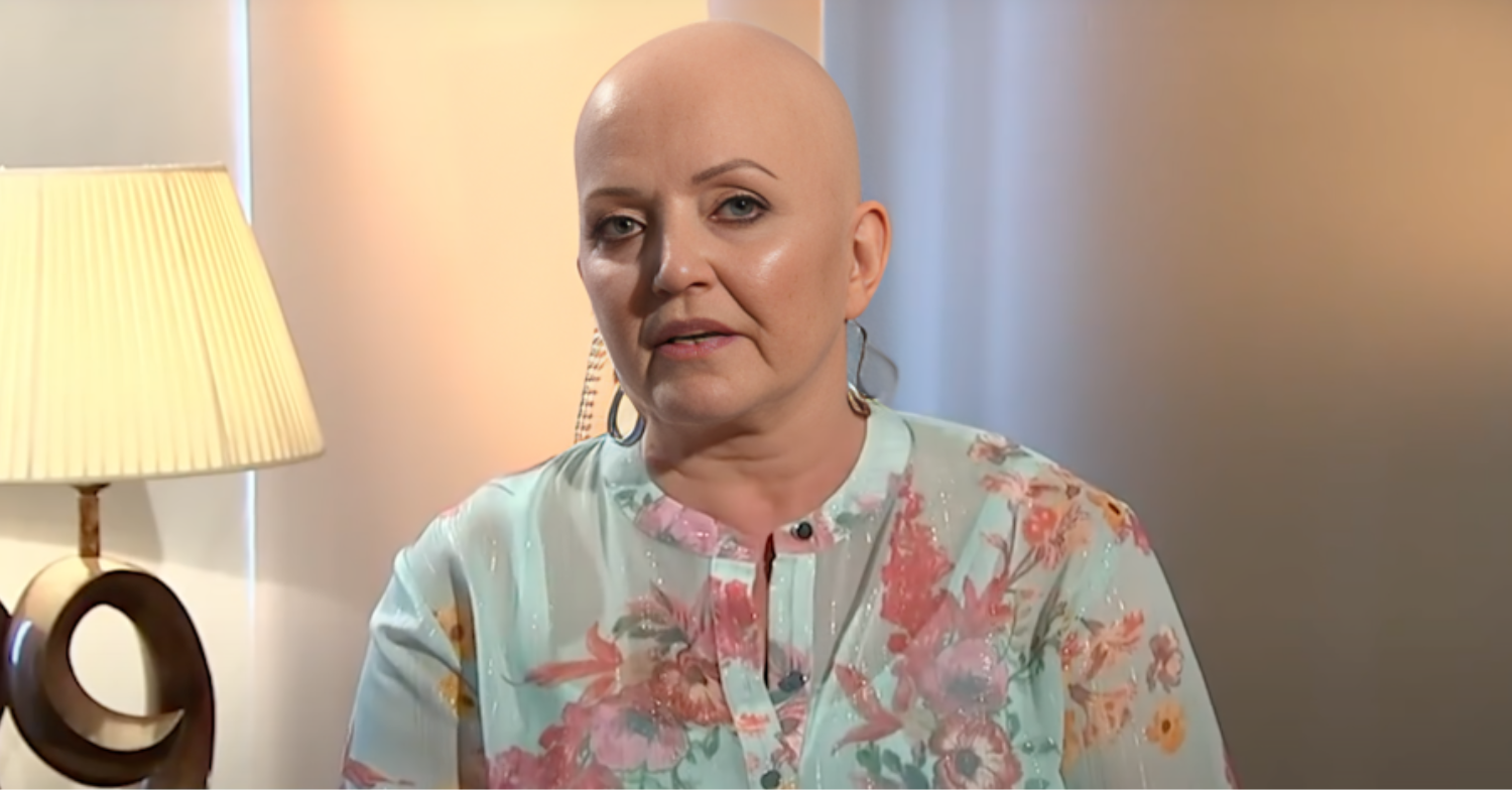 Linda Nolan is bald and wearing a floral shirt being interviewed in her home for Good Morning Britain