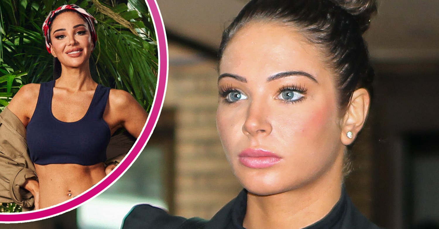 Tulisa looking stern and in her I'm A Celebrity kit