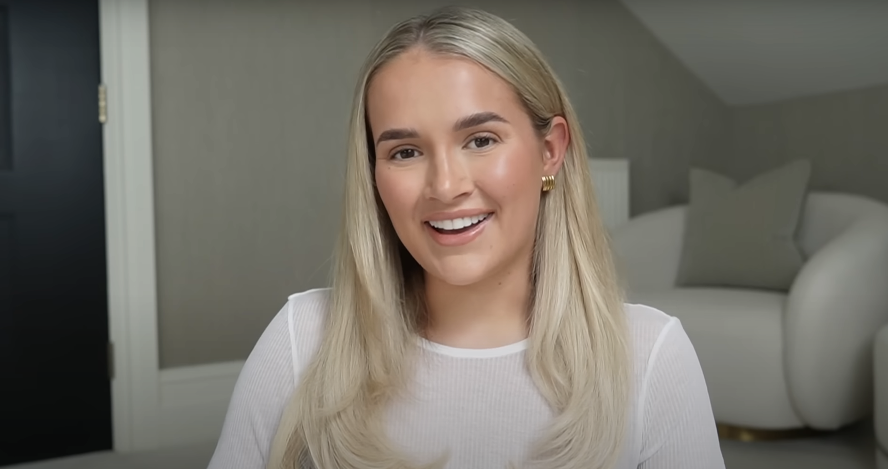Molly-Mae Hague in a white T-shirt recording for her YouTube channel