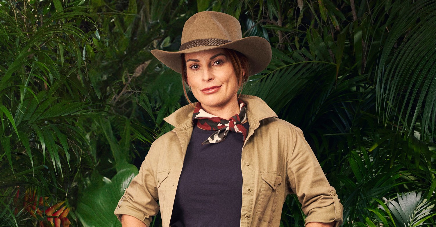Coleen Rooney smiling in an I'm A Celebrity promo pic 