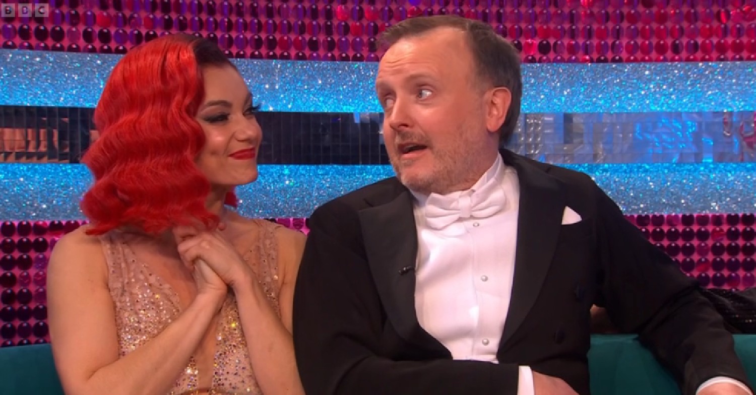 Dianne Buswell smiling and looking at Chris McCausland on Strictly results show