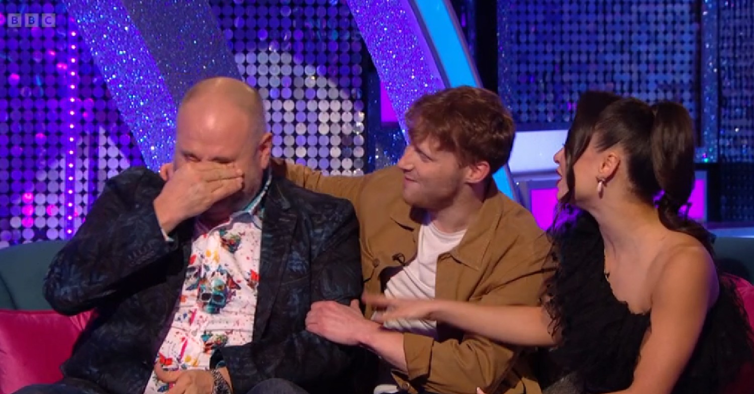 Wynne Evans crying alongside Jamie Borthwick and Katya Jones on Strictly It Takes Two