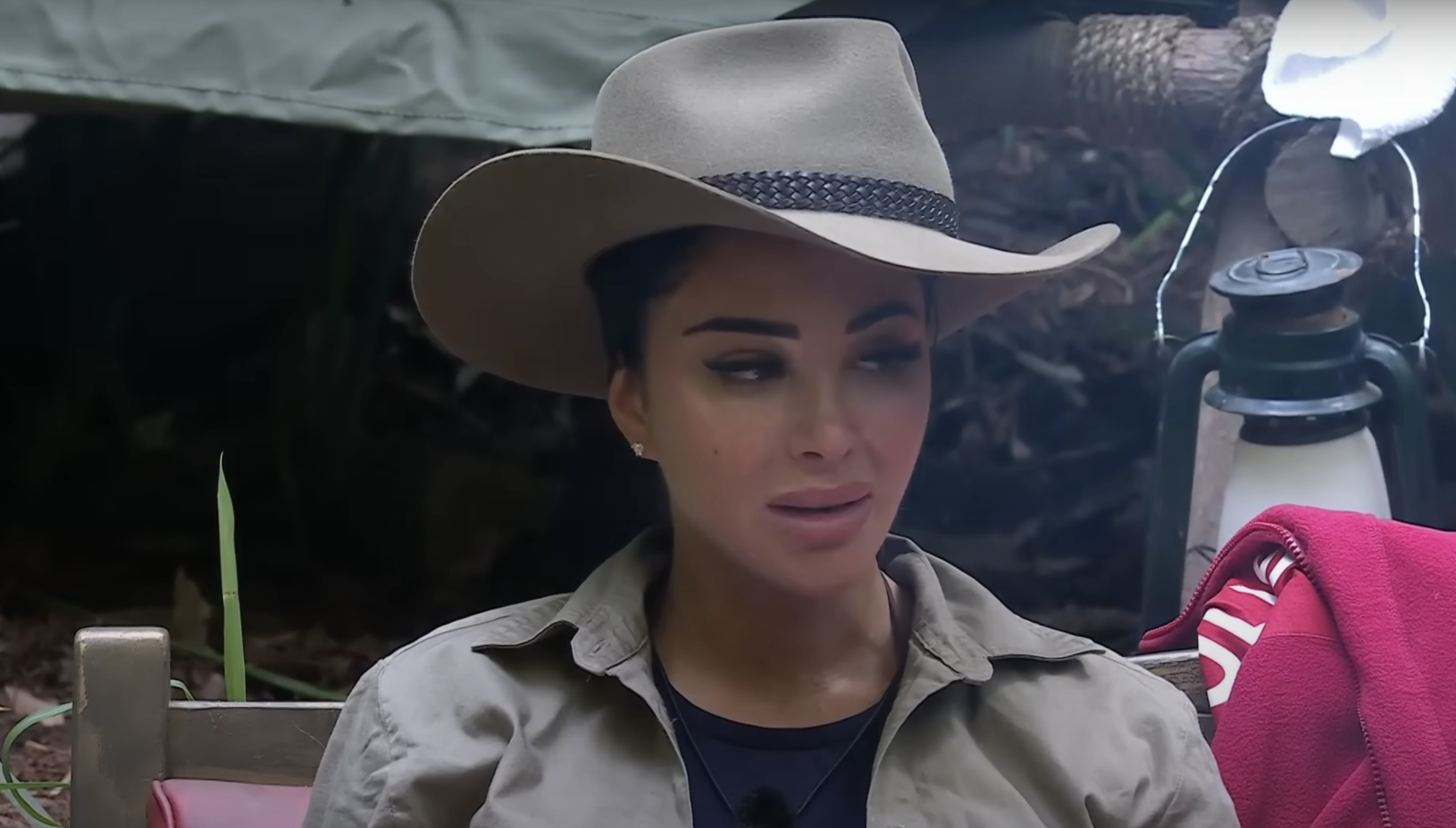 Tulisa Constalvos in a jungle hat dispensing wisdom on grief to campmate Barry McGuigan