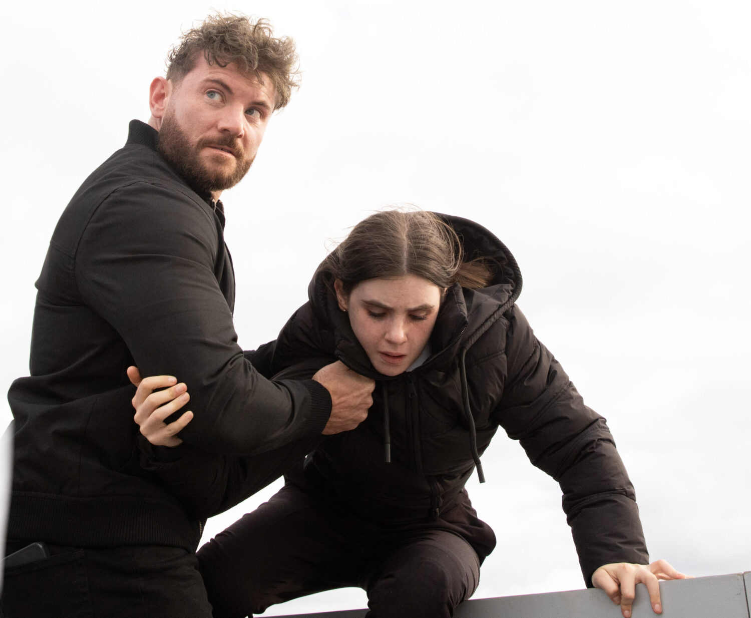 April is being held at a car park by Jade's heavy