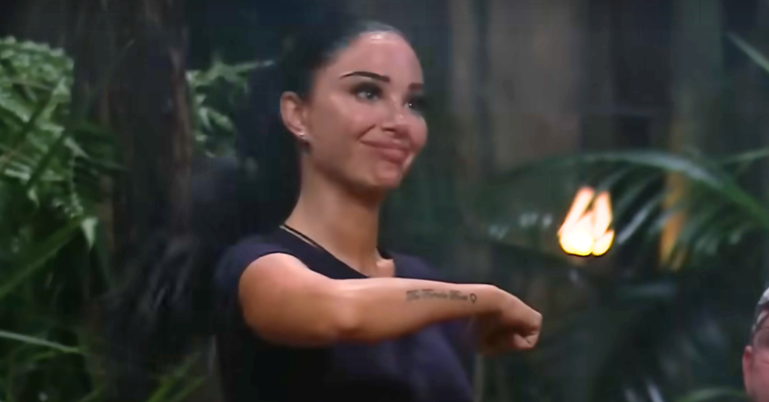 Tulisa Contostavlos strikes her iconic The Female Boss pose on I'm A Celebrity 