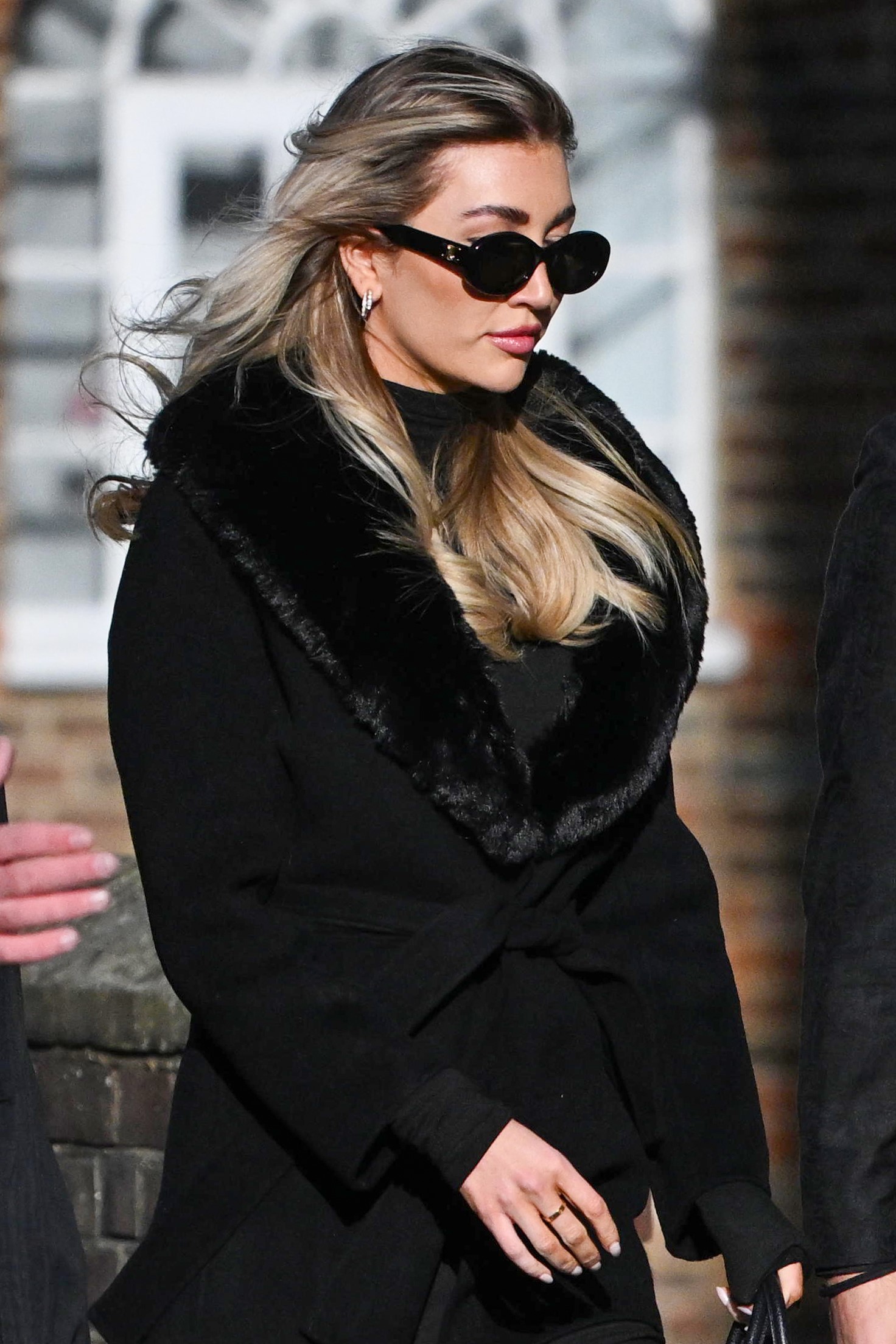 Kate Cassidy in all black and wearing sunglasses at Liam Payne's funeral